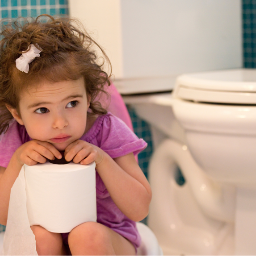 Young child looking anxious about pooping due to encopresis