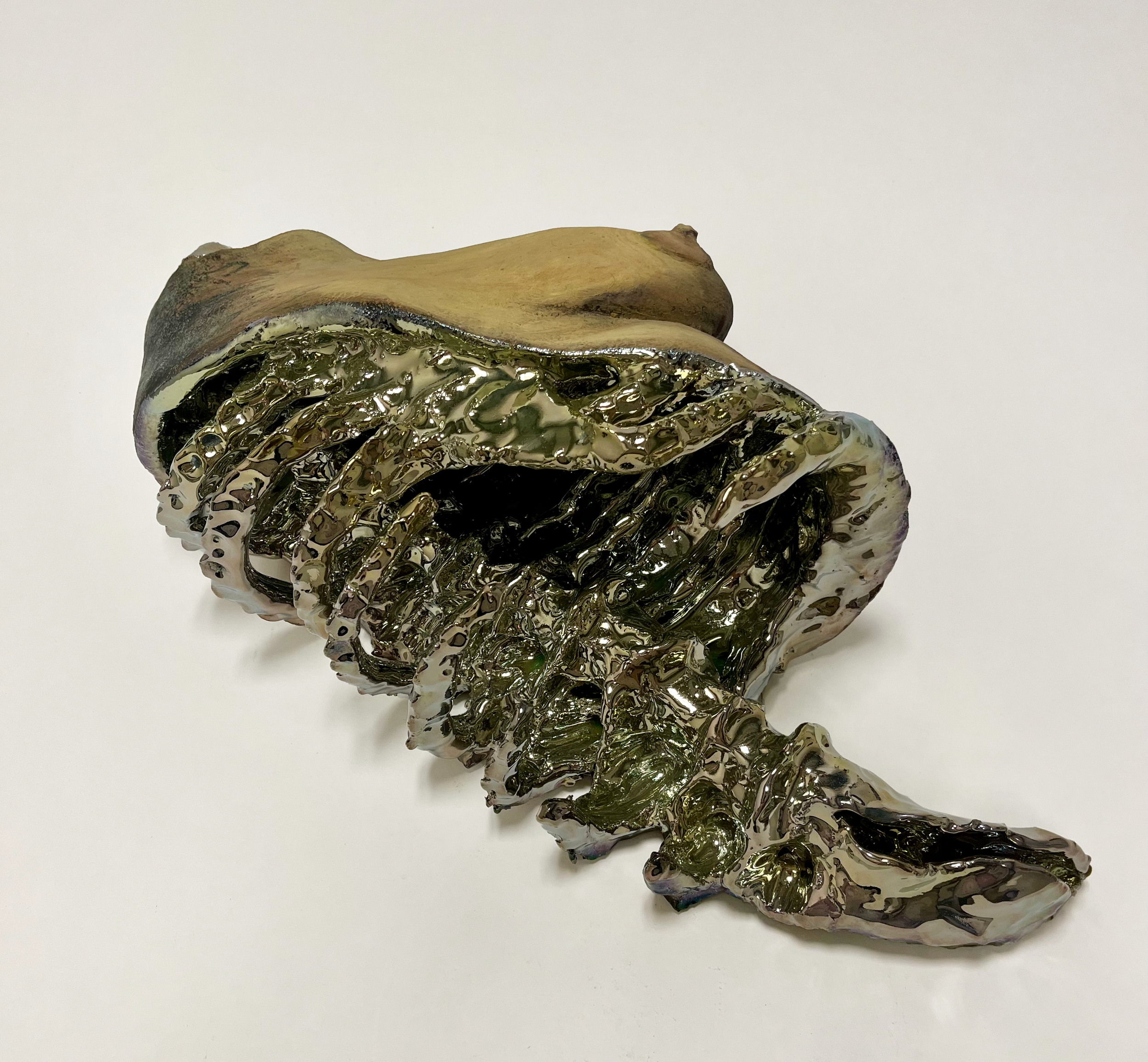 Title: Fissure; Size: H 8" x W 19" X D 11"; Media: Ceramic, Underglaze, Inglaze lustre; Year 2024.
