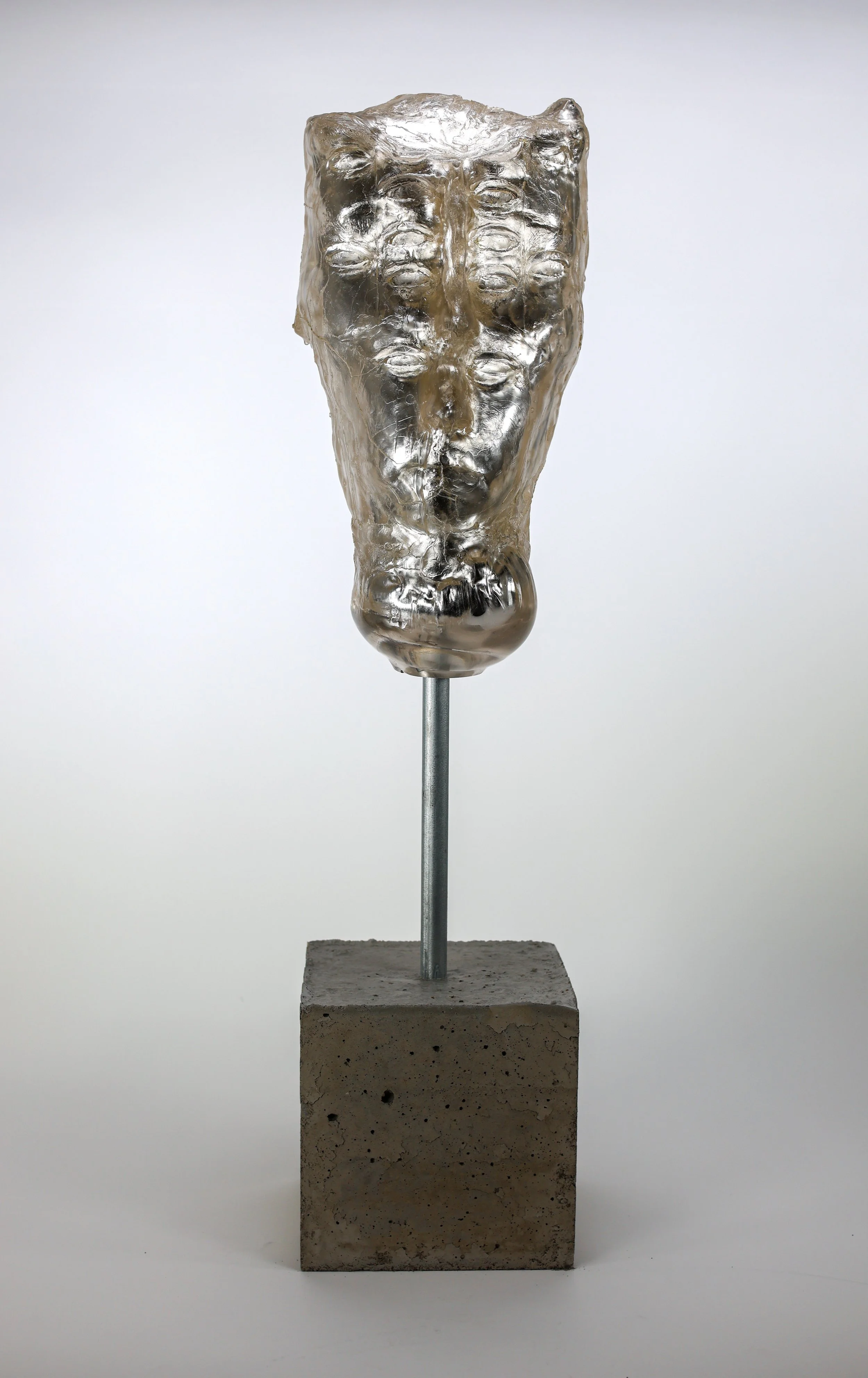 Title: Numen; Media: Mold blown glass, mirrored, steel and concrete. Size with base: 30" x 7" x 7". Glass Head: 15" x 6" x 7"; Year: 2022