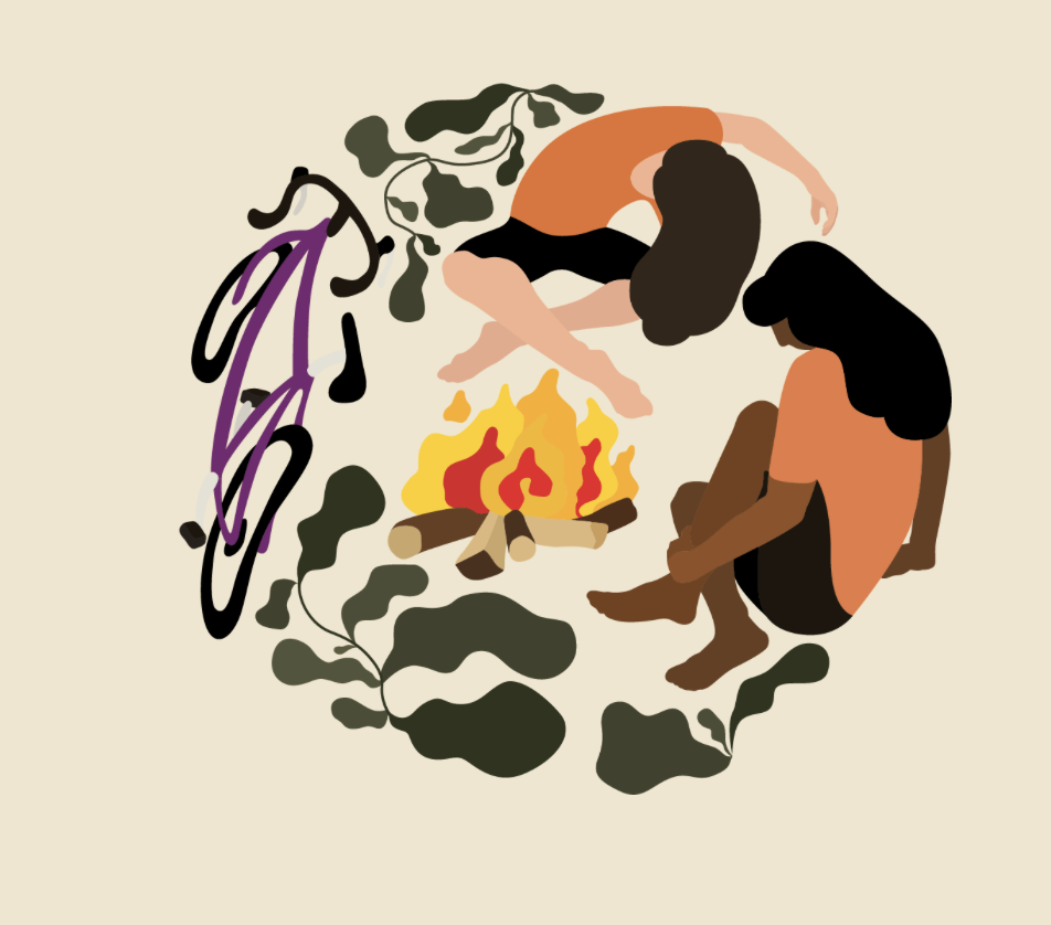Two people sitting around a campfire with a large leafy branch overhead.