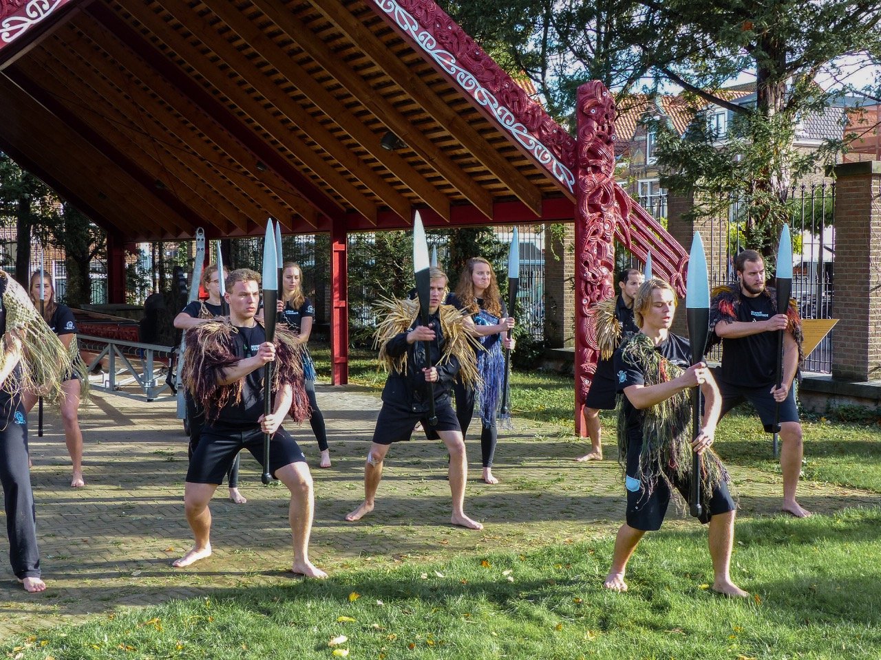  Production still from ‘Going Native’ (2017/2022) by Yuki Kihara.   Featuring  ‘ Te hono ki Aotearoa: The Link To New Zealand’ student rowing club members performing the haka (Māori ceremonial war dance) in Leiden, The Netherlands. Photo by Wonu Veys