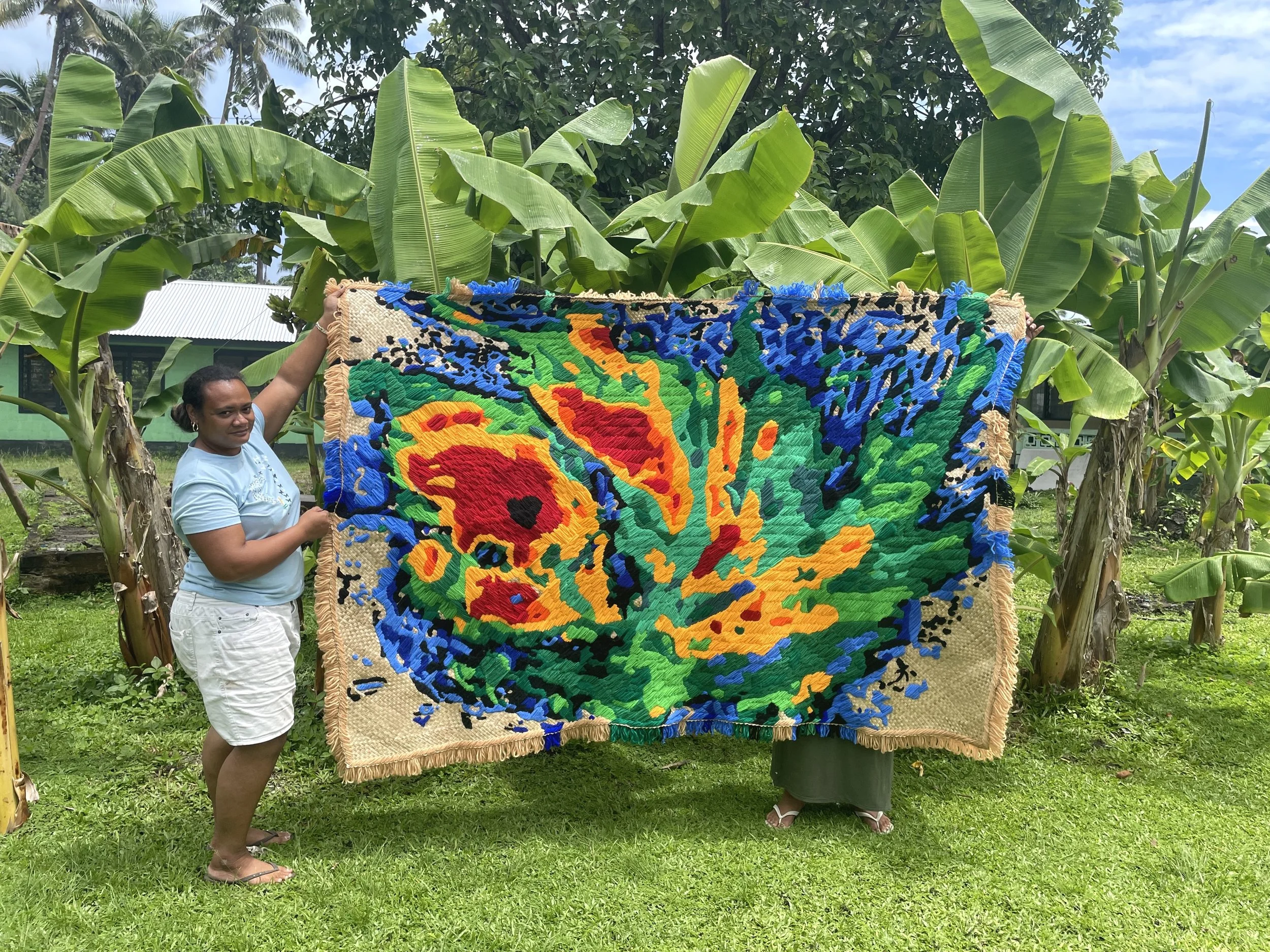  ‘Zazu’ (2026) by Yuki Kihara. Woollen embroidery on pandanus mat. Approx. 2.4 mt x 1.5 mt. Photo by Yuki Kihara. Courtesy of Yuki Kihara. 