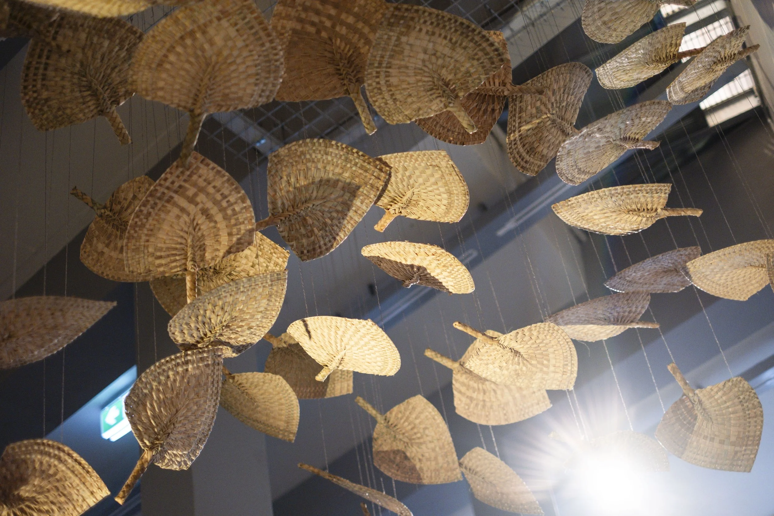  'Winds of Change' (2026) site-specific installation by Yuki Kihara. Ili supplied by The Sāmoa Victim Support Group (SVSG). Installation photo by Ted Whitaker. Courtesy of Te Pātaka Toi Adam Art Gallery, Aotearoa New Zealand. 