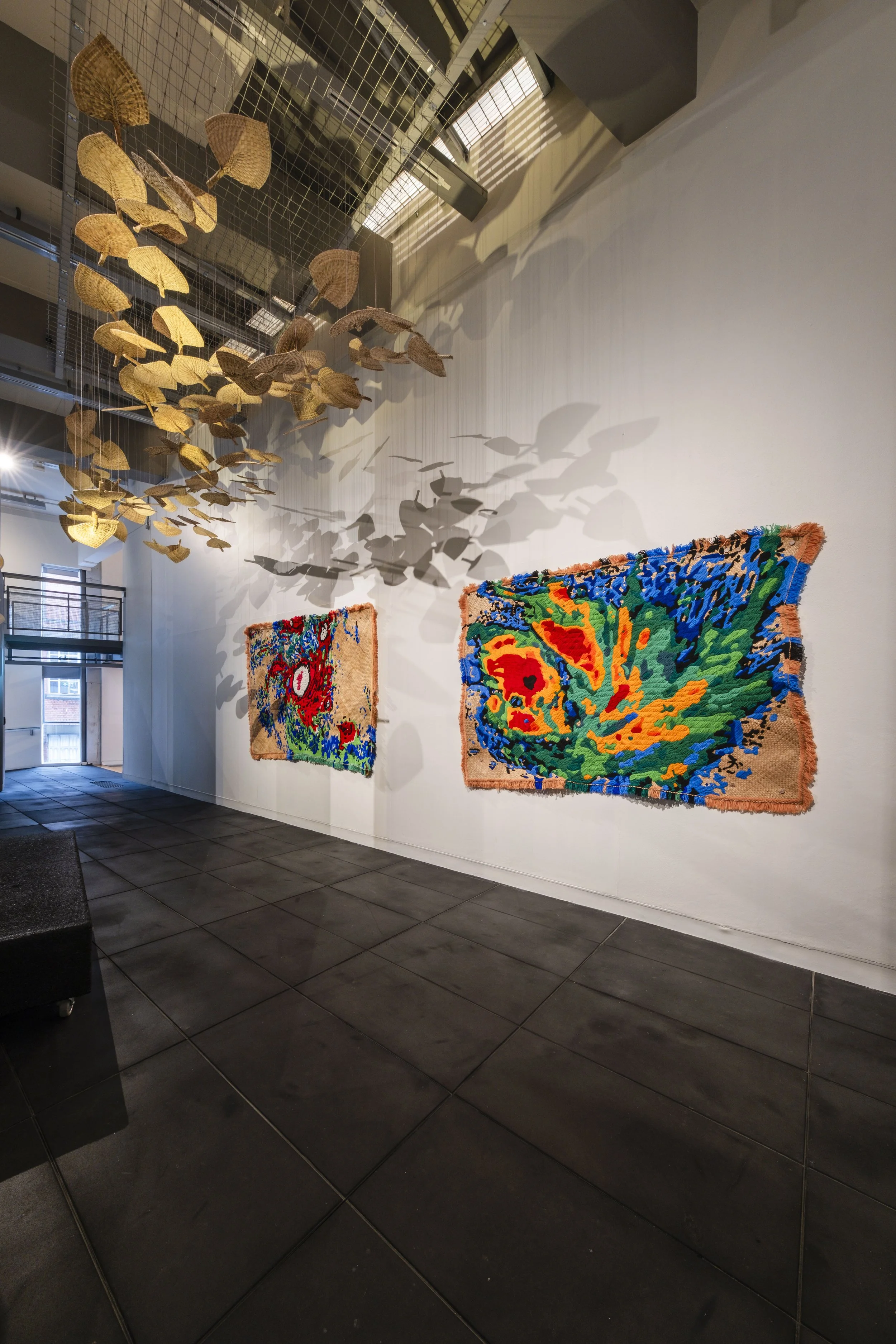  'Winds of Change' (2026) site-specific installation by Yuki Kihara. Ili supplied by The Sāmoa Victim Support Group (SVSG). Installation photo by Ted Whitaker. Courtesy of Te Pātaka Toi Adam Art Gallery, Aotearoa New Zealand. 