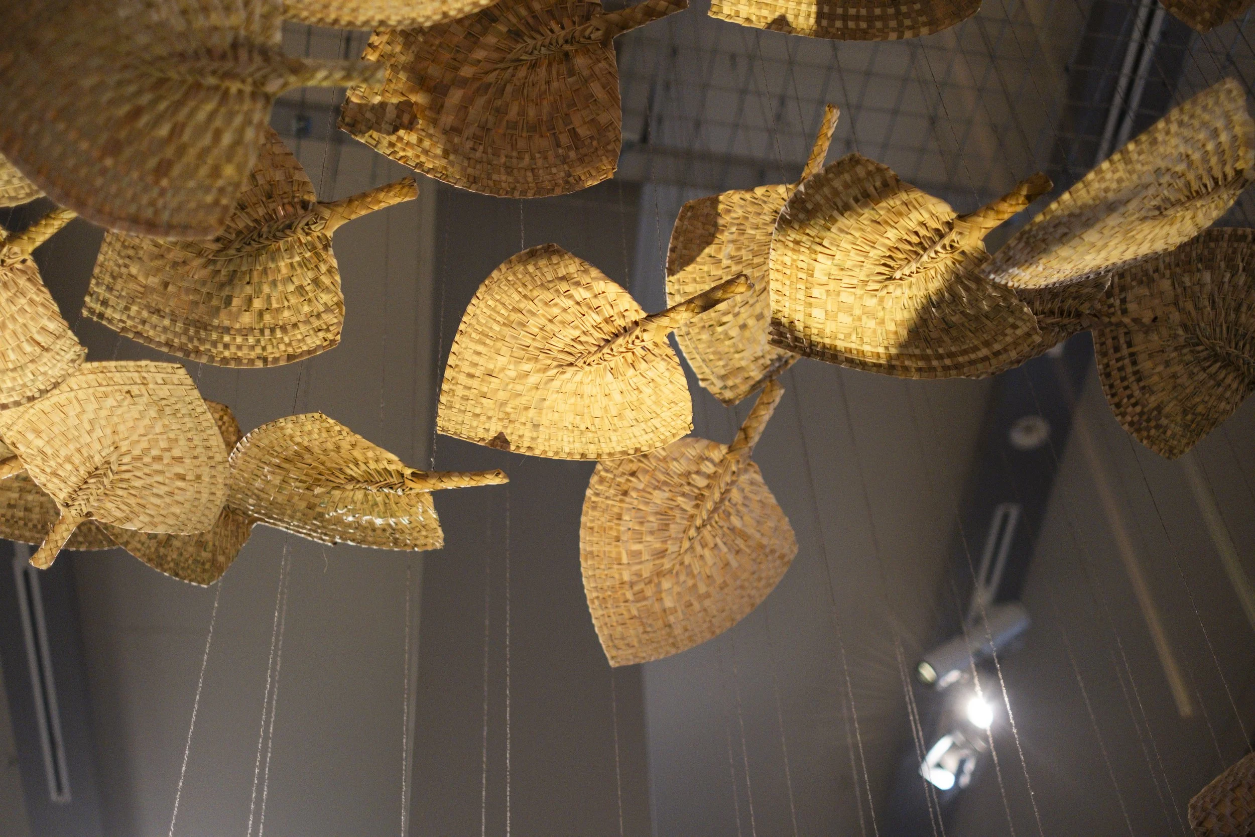  'Winds of Change' (2026) site-specific installation by Yuki Kihara. Ili supplied by The Sāmoa Victim Support Group (SVSG). Installation photo by Ted Whitaker. Courtesy of Te Pātaka Toi Adam Art Gallery, Aotearoa New Zealand. 