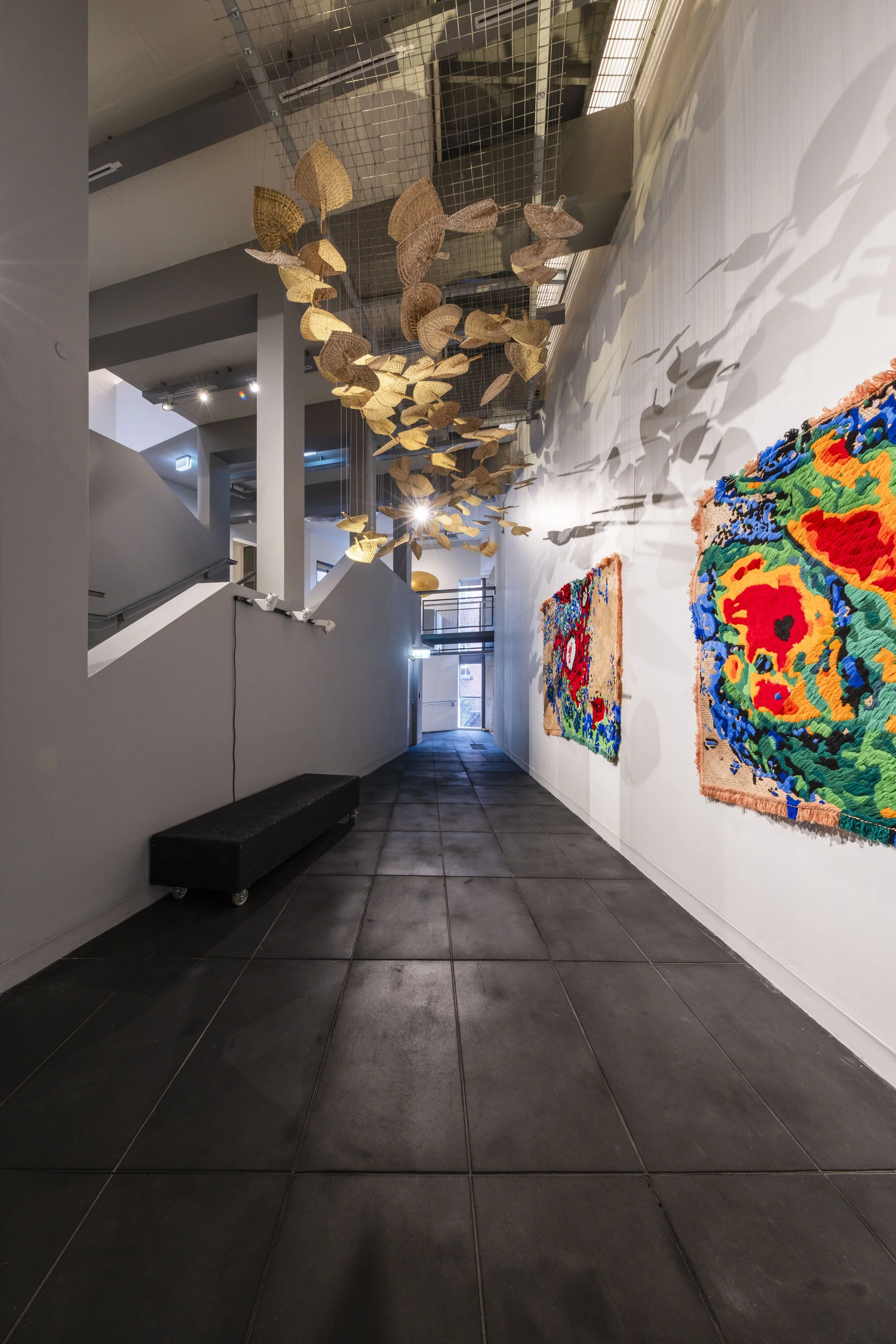  'Winds of Change' (2026) site-specific installation by Yuki Kihara. Ili supplied by The Sāmoa Victim Support Group (SVSG). Installation photo by Ted Whitaker. Courtesy of Te Pātaka Toi Adam Art Gallery, Aotearoa New Zealand. 