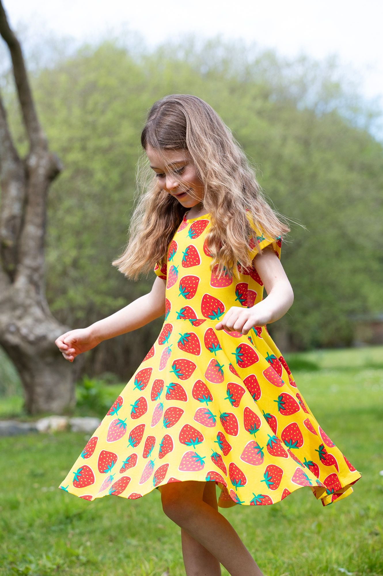 Girl_wearing_Frugi_Strawberry_dress.jpeg