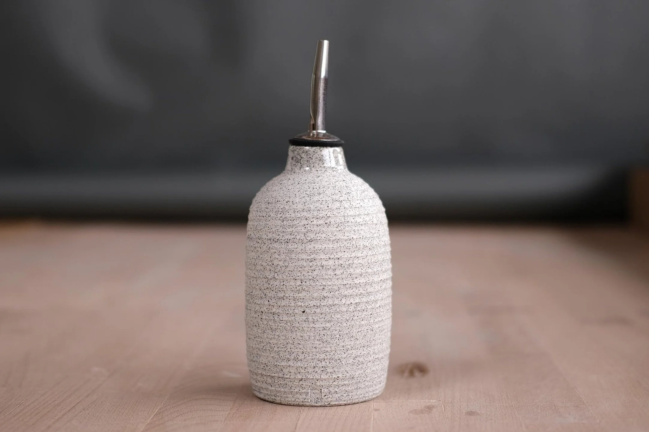 carved speckled porcelain oil cruet