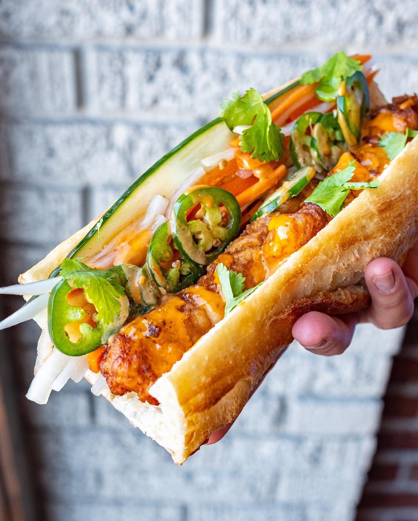One more Fish Friday special! This one is our tempura cod b&aacute;nh m&igrave;, including house tempura cod, pickled carrot and daikon, cucumber, jalape&ntilde;o, cilantro, and a drizzle of bang bang sauce on b&aacute;nh m&igrave; bread. Only a limi