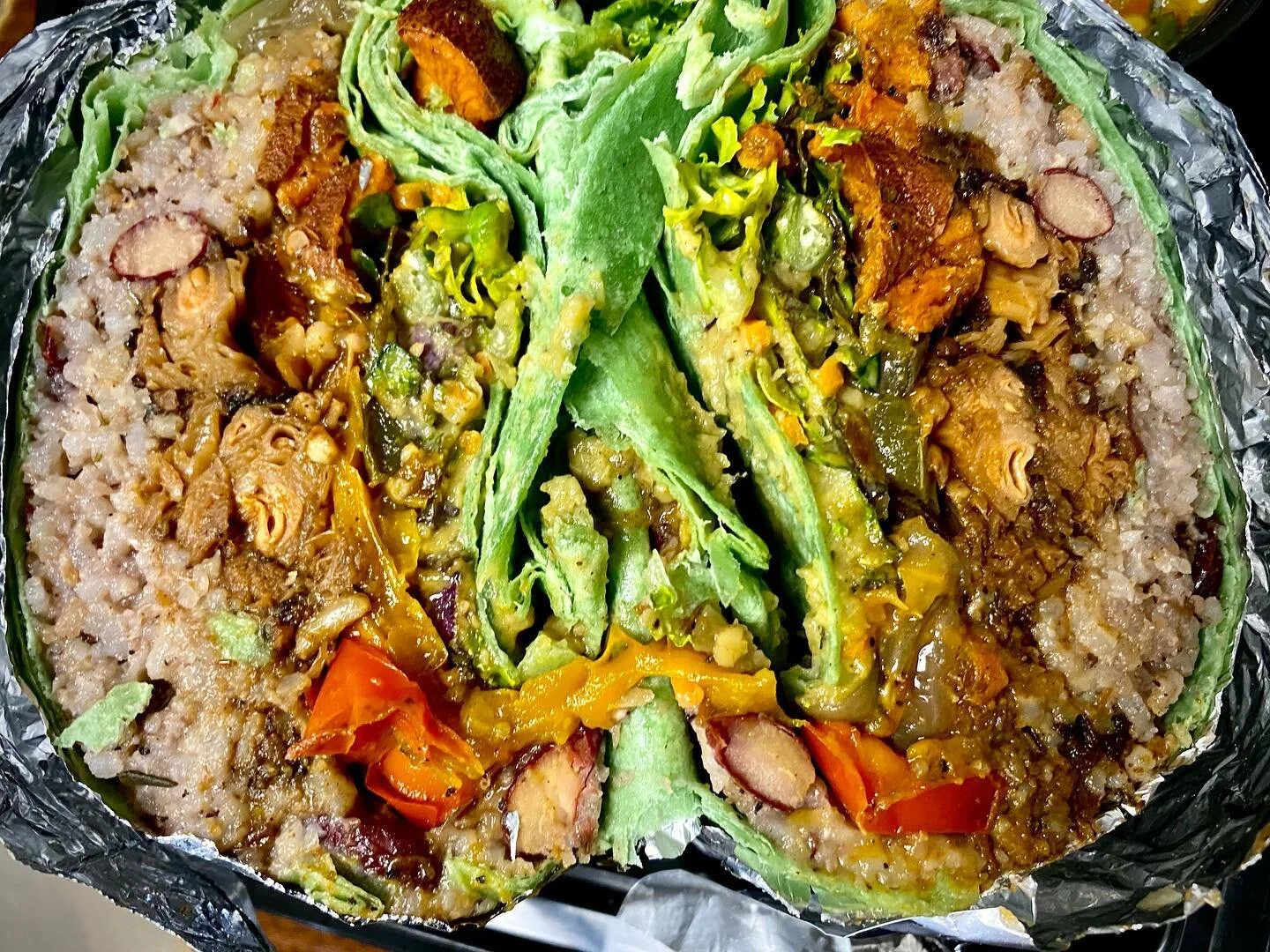 THA JACKTAIL BURRITO has returned &amp; even better than the original. Enough for 2 people, the Anjahles @anjahles jacktail burrito has slow cooked marinated jackfruit, spiced sweet potatoes, rice &amp; peas, Rasta fajitas, fresh kaleslaw, avocado je