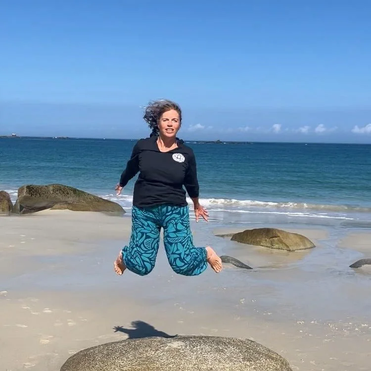 Marie D. in France wearing ShareLove.Fund's signature thin grey hoodie