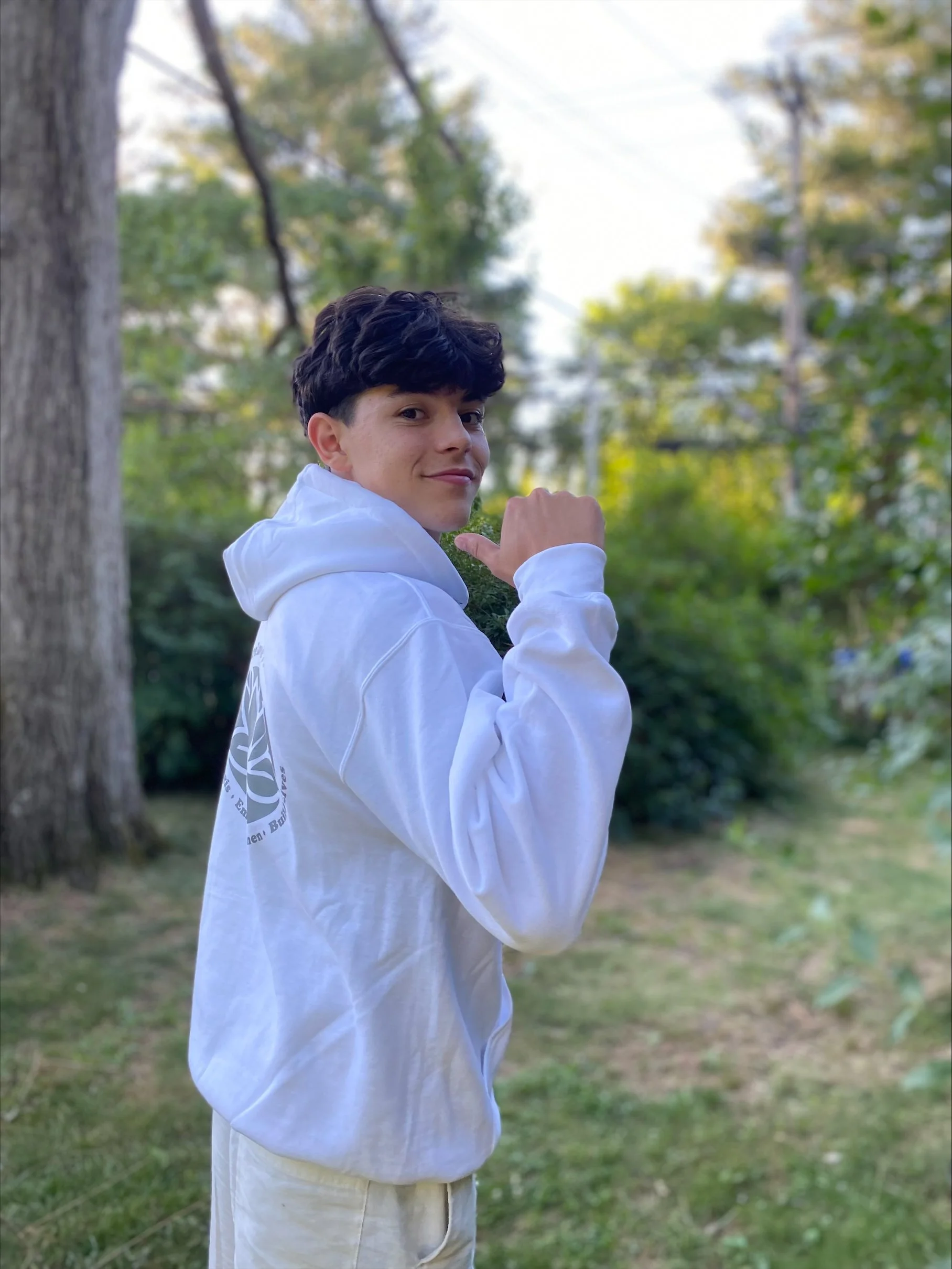 Joseluis Lopez-Sanchez in grey ShareLove.Fund sweatshirt.