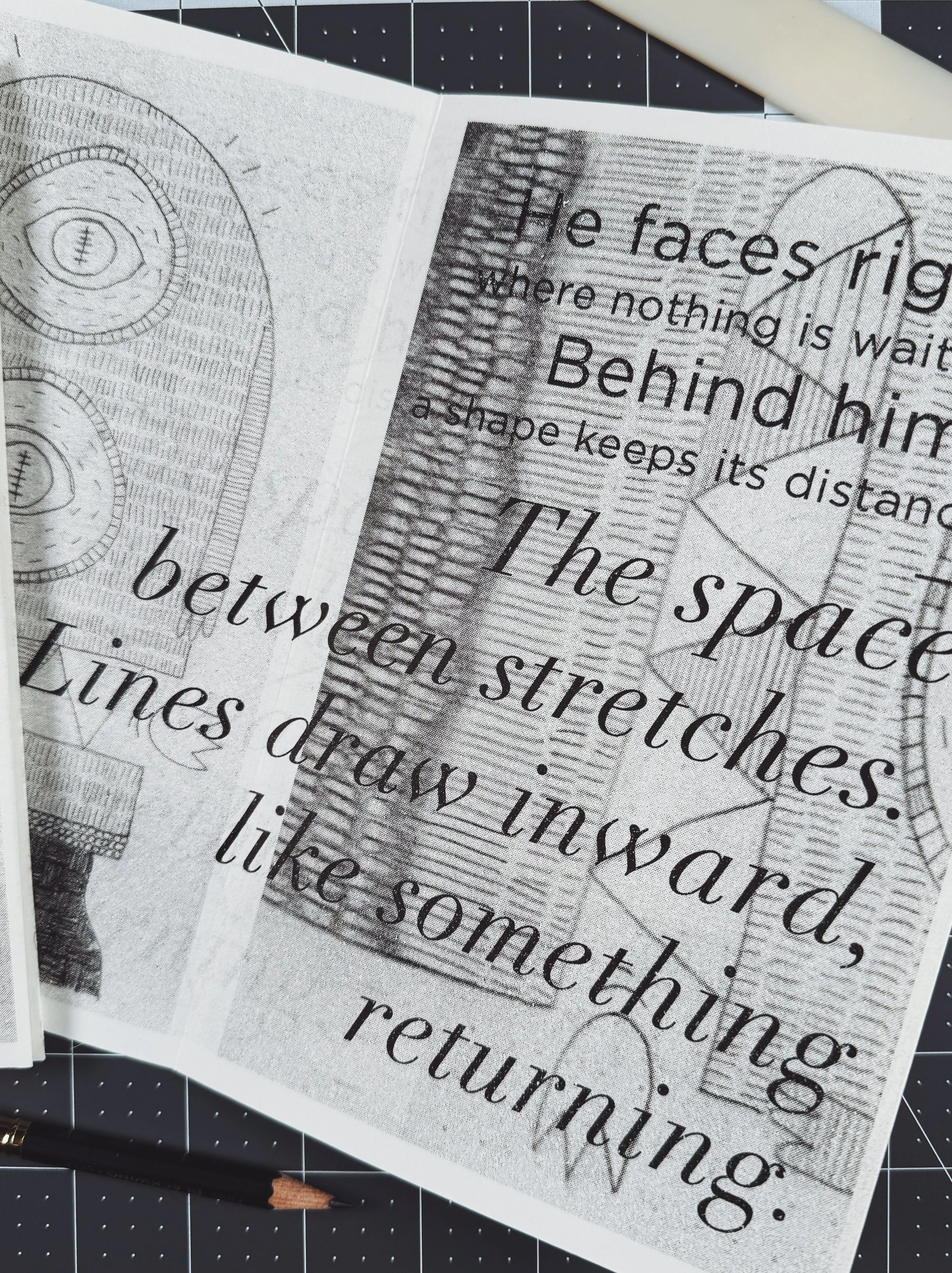 Close-up of a page of printed text on paper with an sketch on the left side and a masked drawing on the right side, featuring overlapping printed words and design elements.