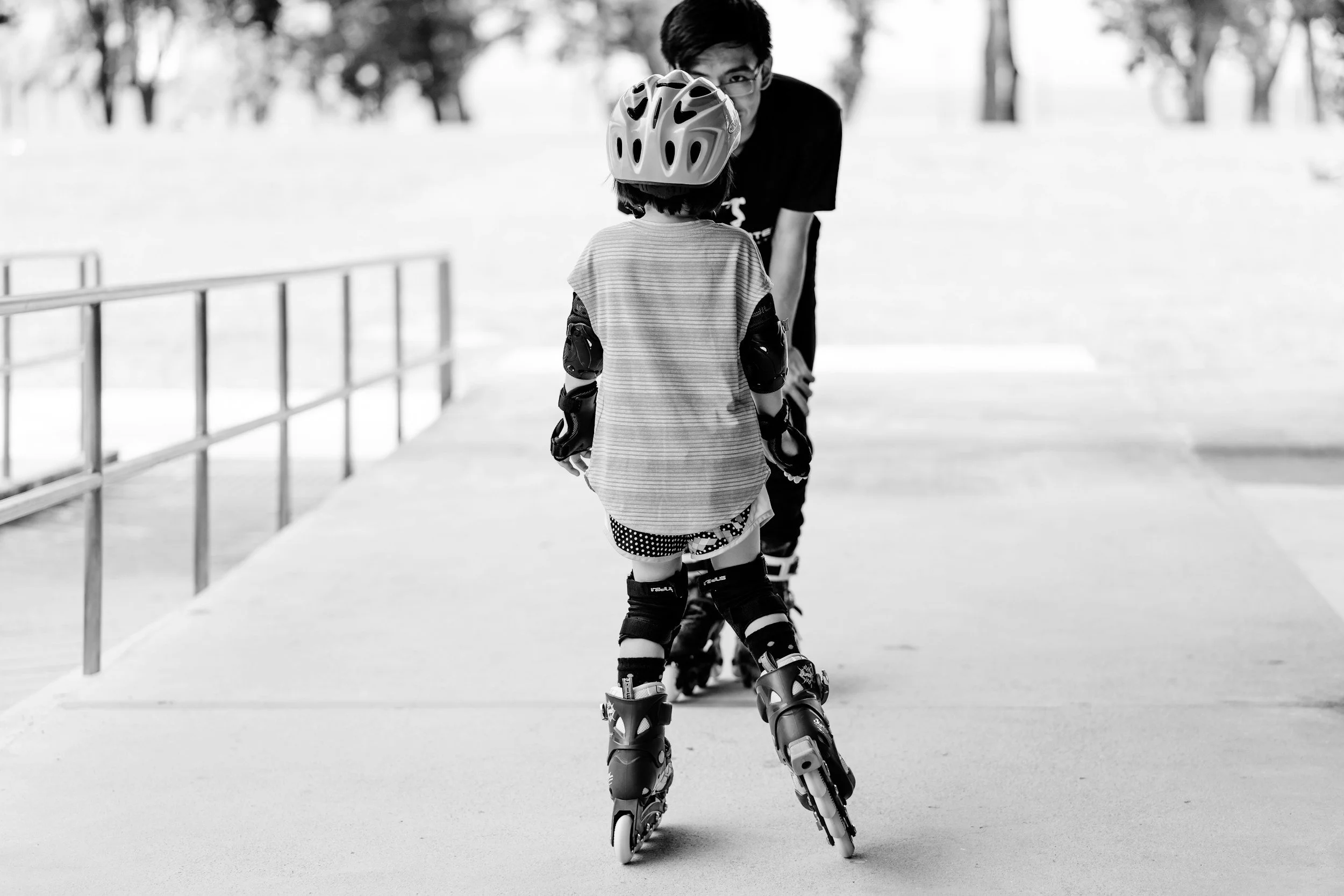 B/W photos of hockey player with his coach