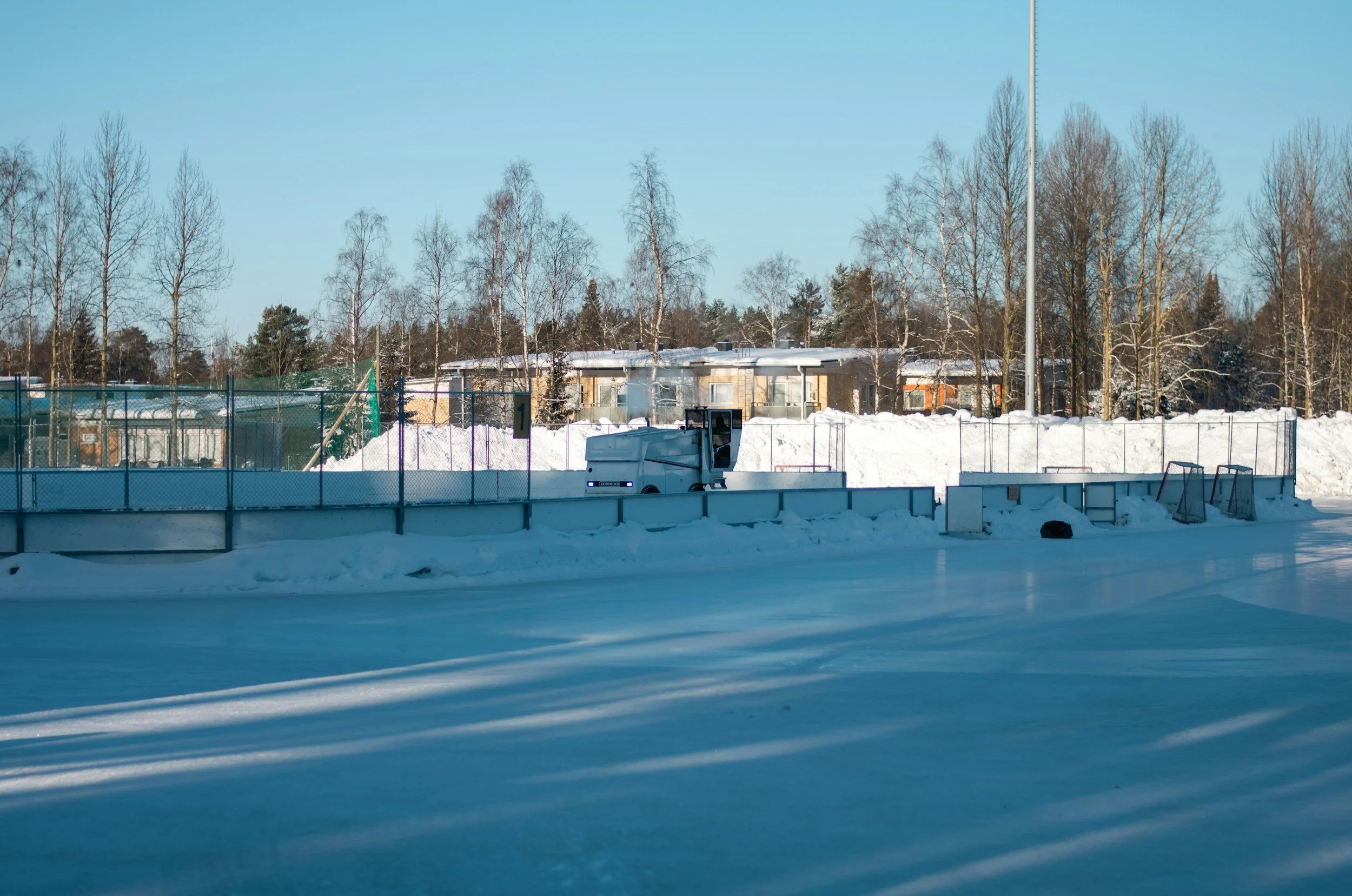 View of ice hockey rink covered in snow