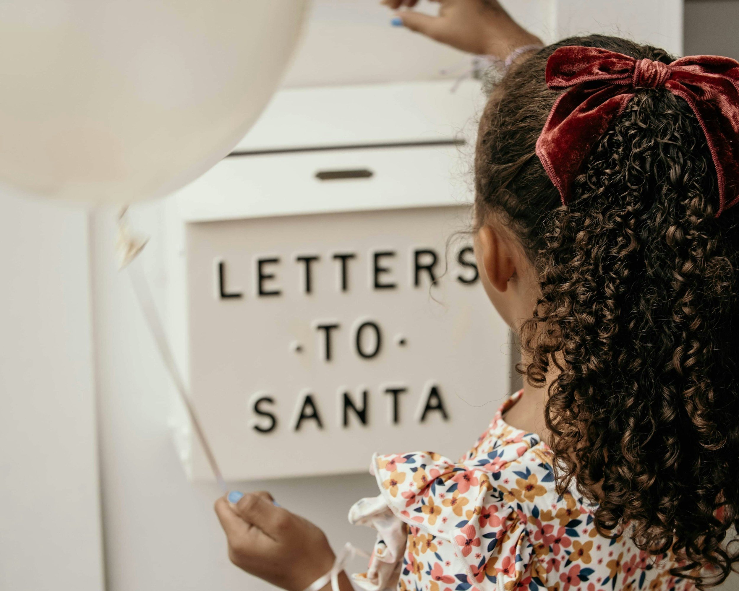 Girl sending a letter to santa