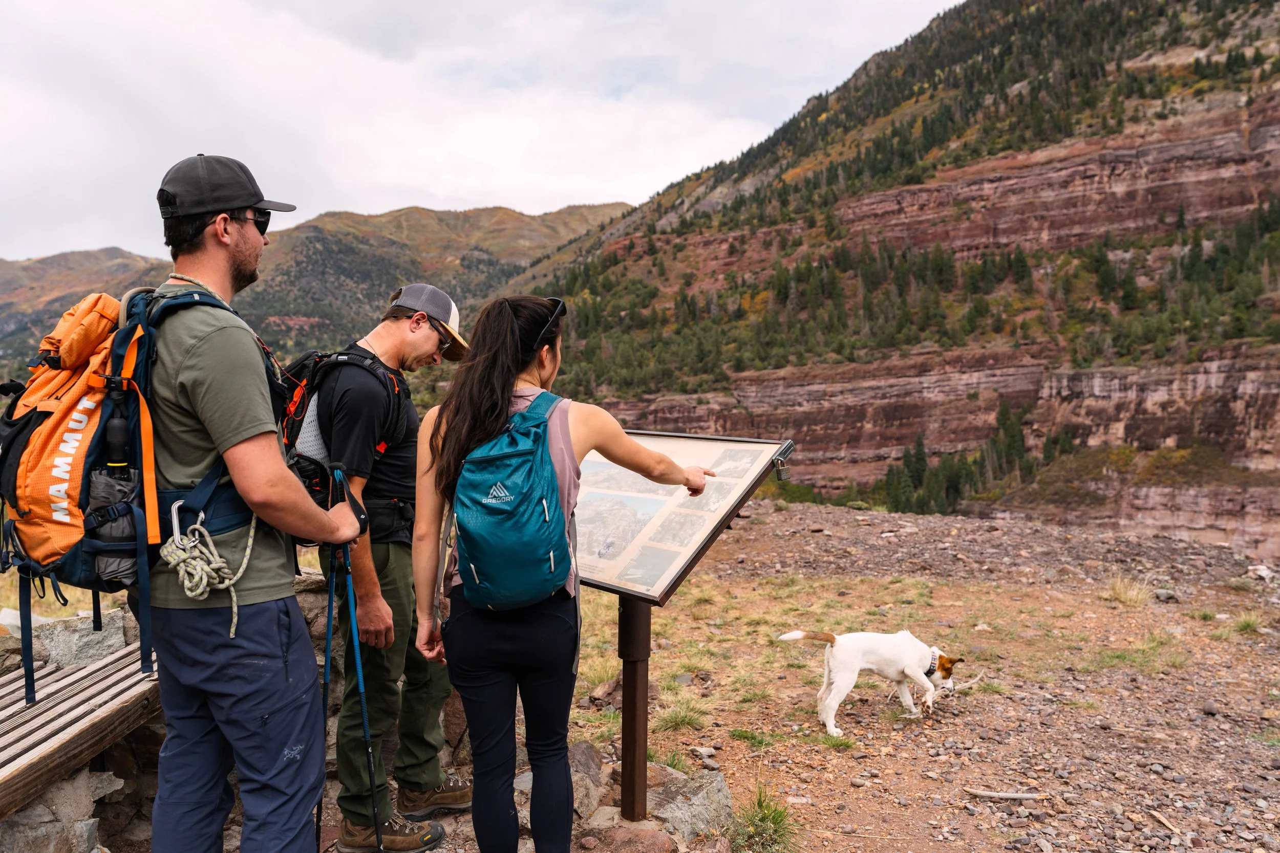 People looking at informational sign on Silvershield Trail