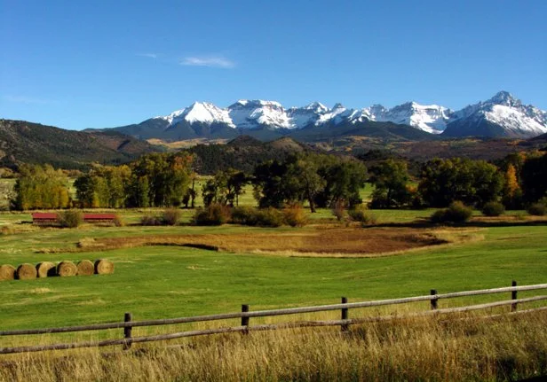 Mount Sneffels rising above alpine terrain in the San Juan Mountains near Ouray Colorado