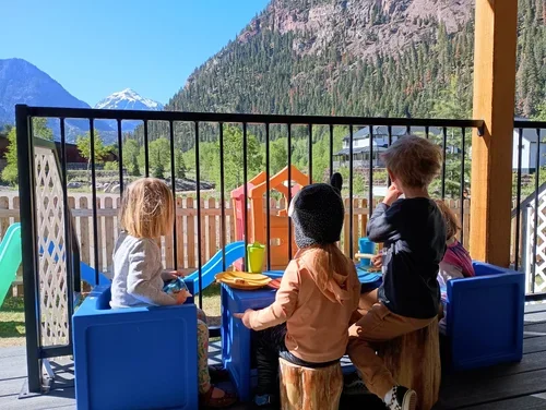 Kids playing at kids table on porch
