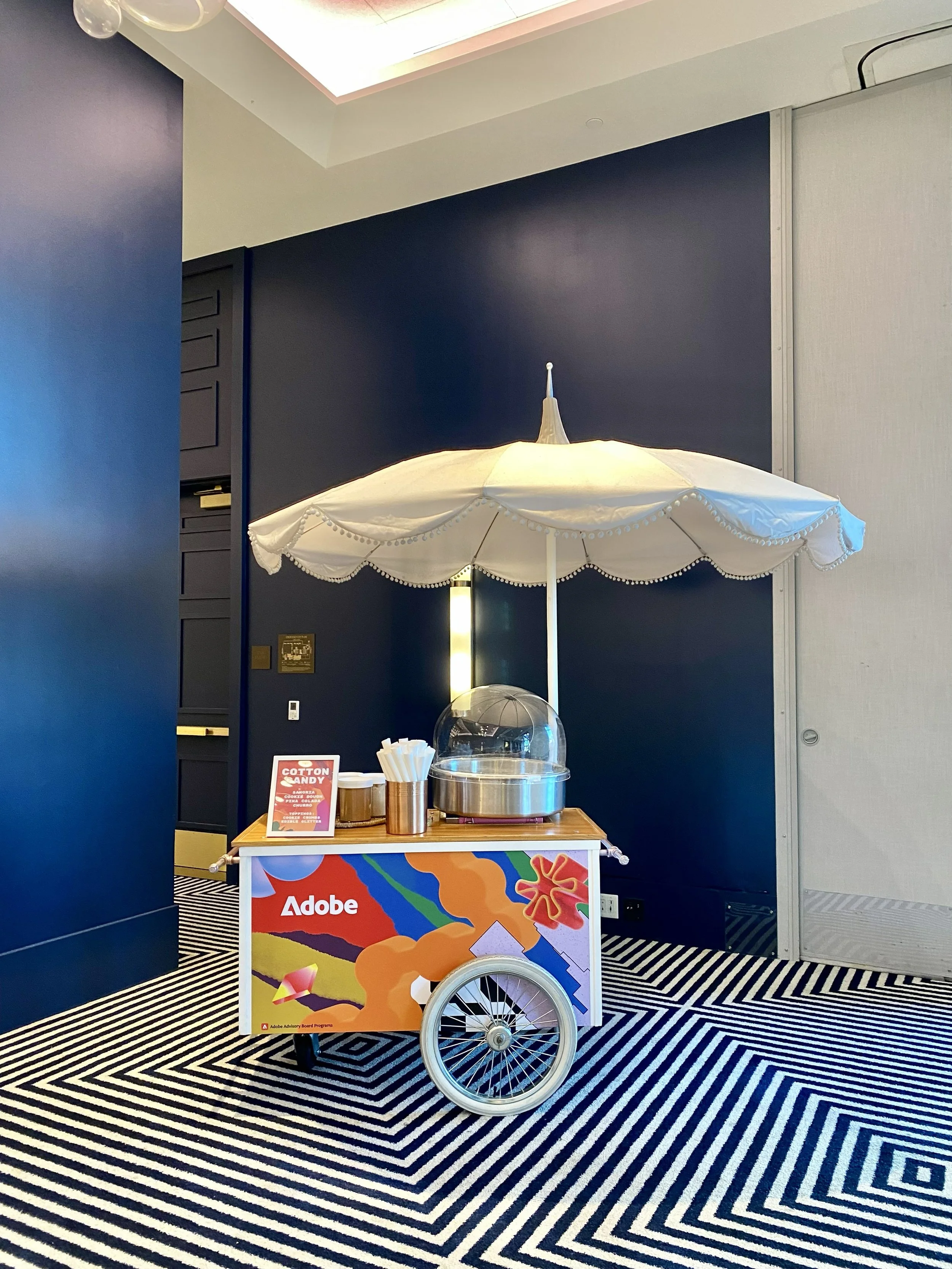Adobe-branded cotton candy cart at Adobe MAX 2023, Los Angeles Convention Center