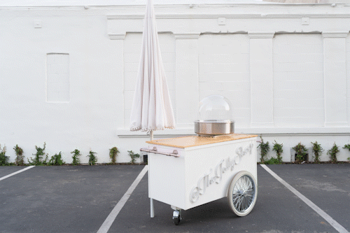 Catering cart with three umbrella and countertop combinations for different event styles