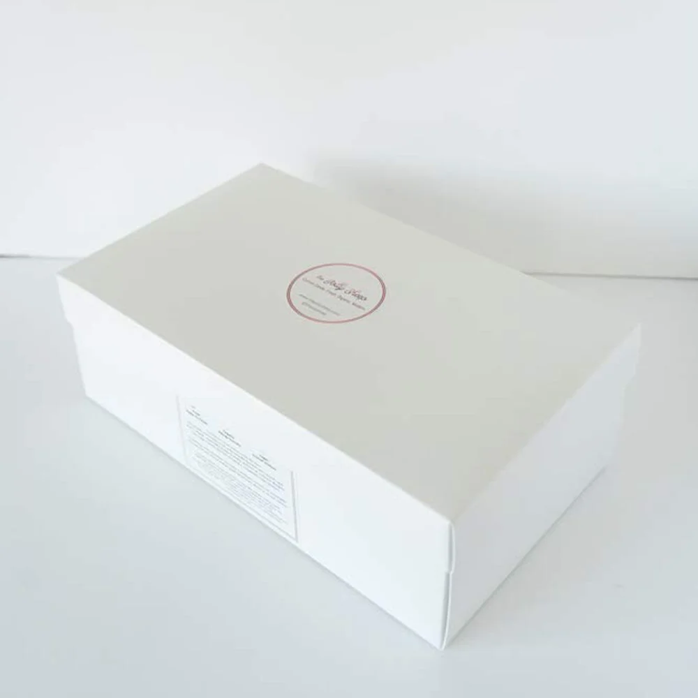a closed gift box with cotton candy bags inside