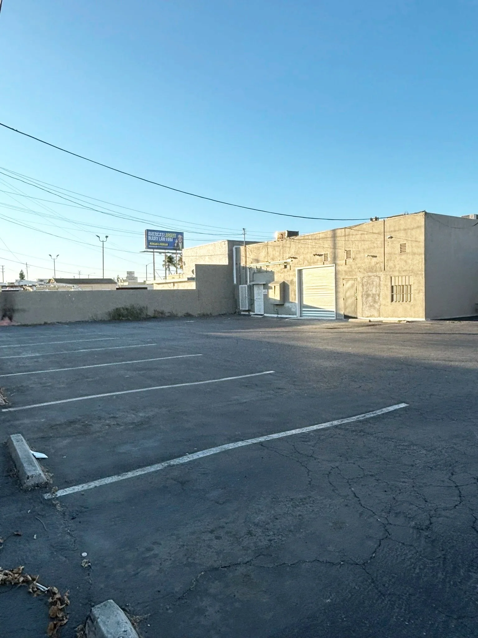 Exterior view with 12 dedicated parking spaces behind the building