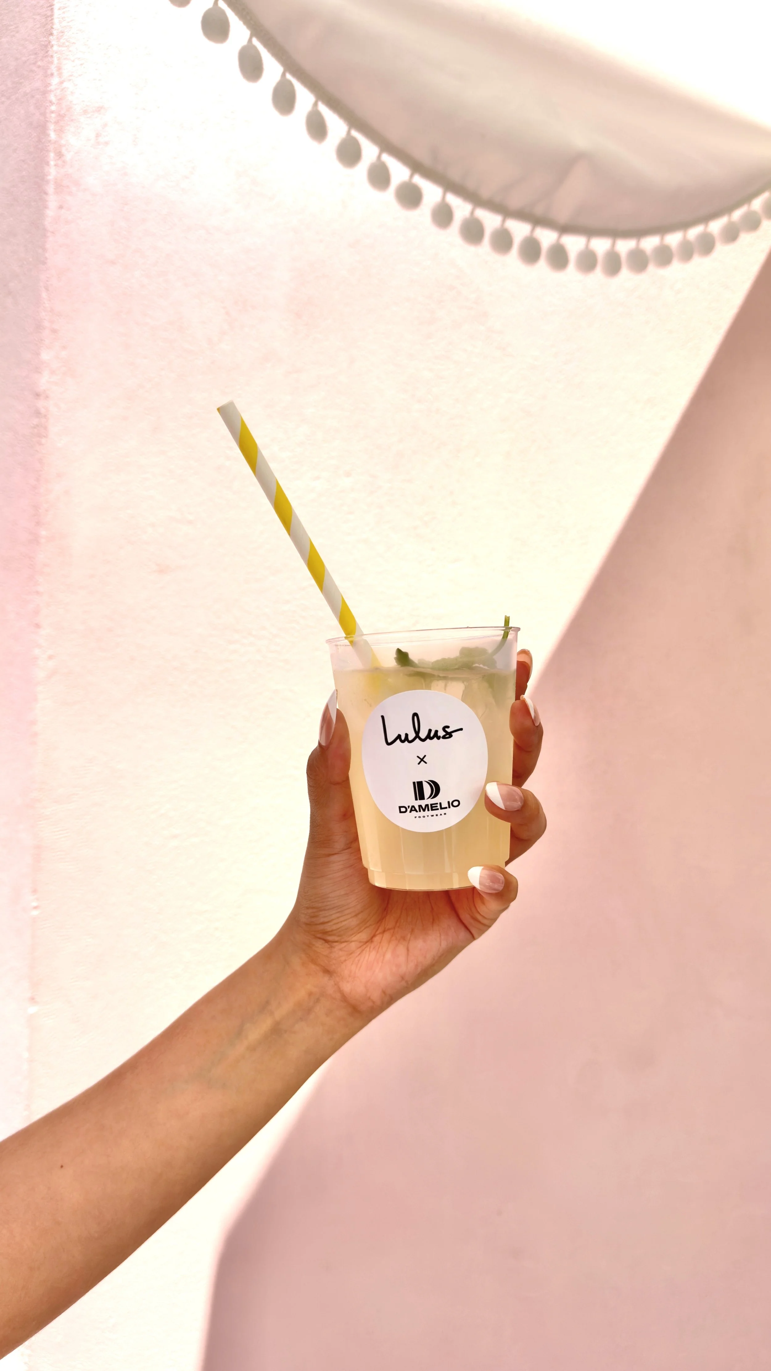 a custom label lemonade cup for a lulus x d'amelio footwear event