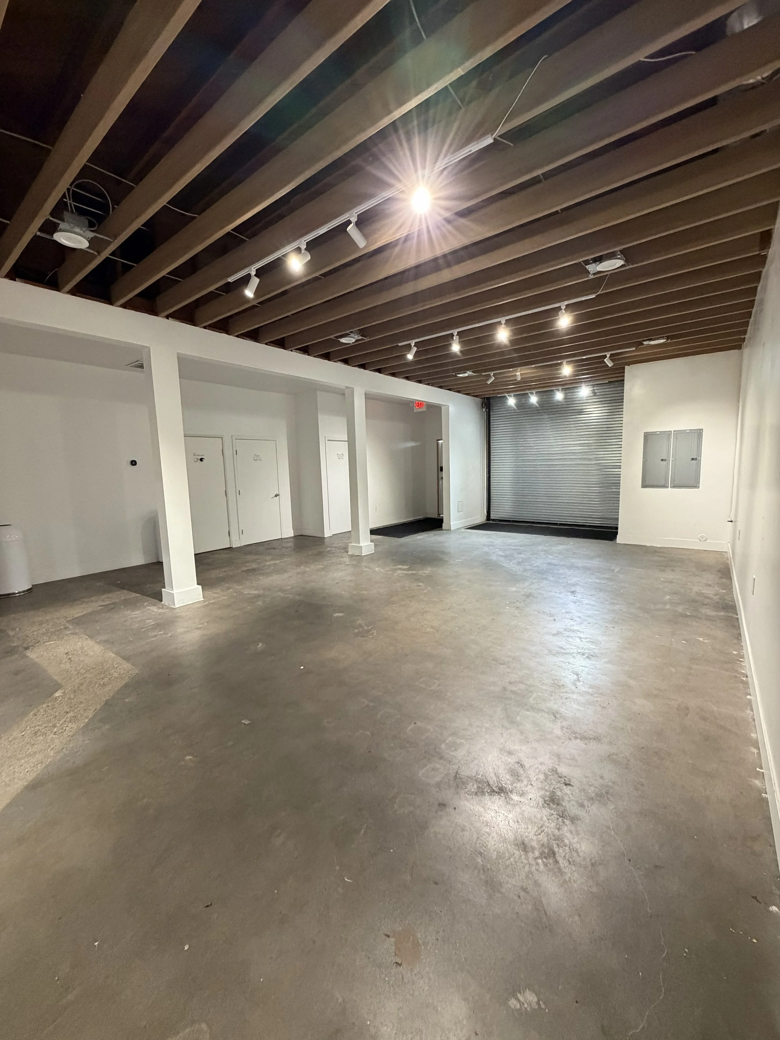 Main event space facing the 10ft roll-up door — Norwalk warehouse venue