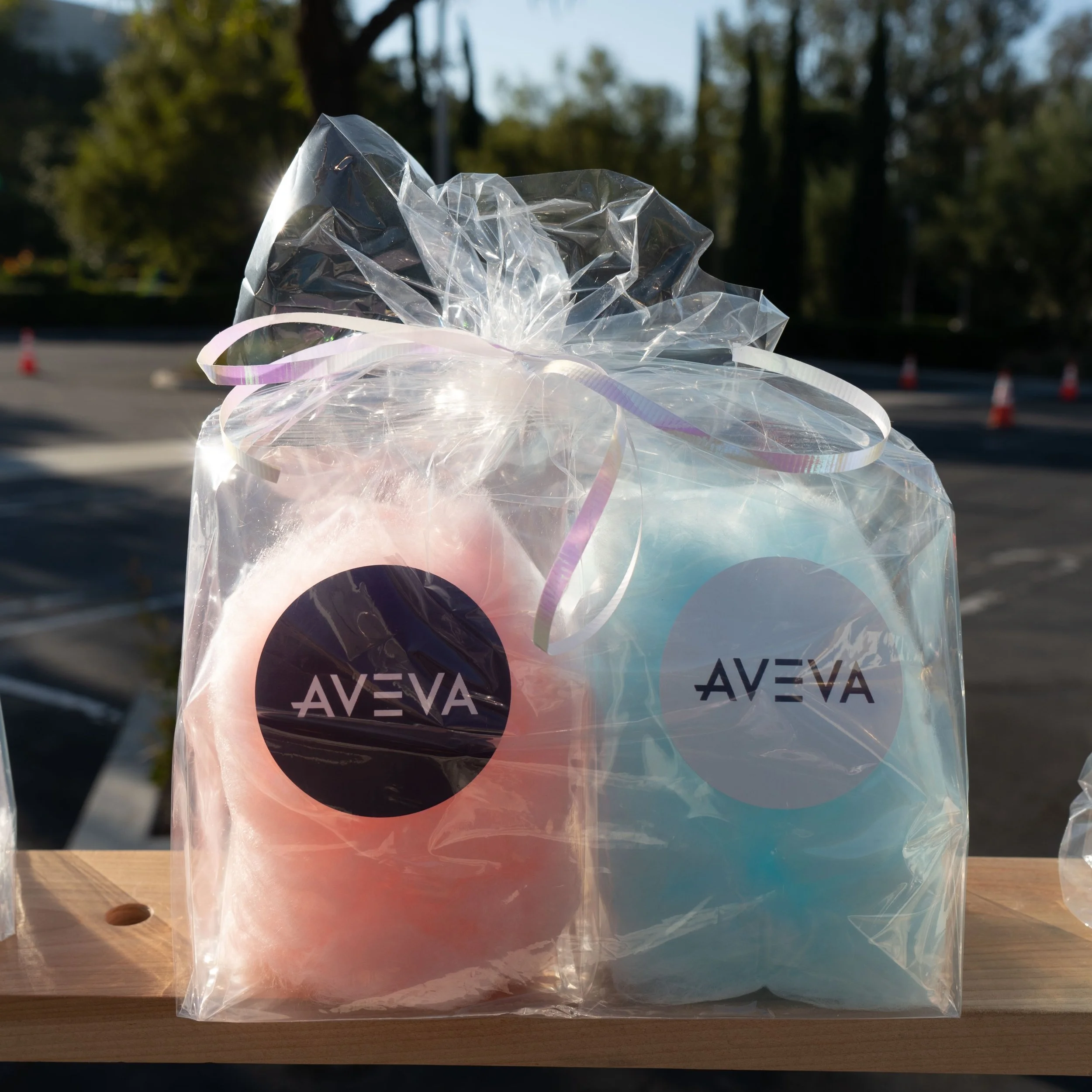 Custom cotton candy favors in an outer twist bag for an AVEVA company event