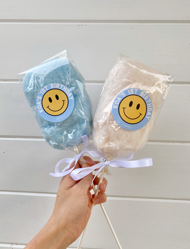 mini cotton candy on a stick with a 1st birthday custom label
