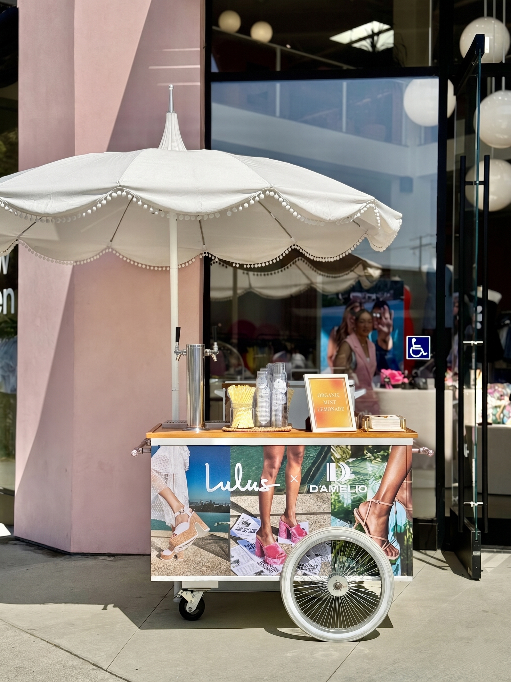 the jolly sheep lemonade cart at a brand activation for a lulus d'amelio collab