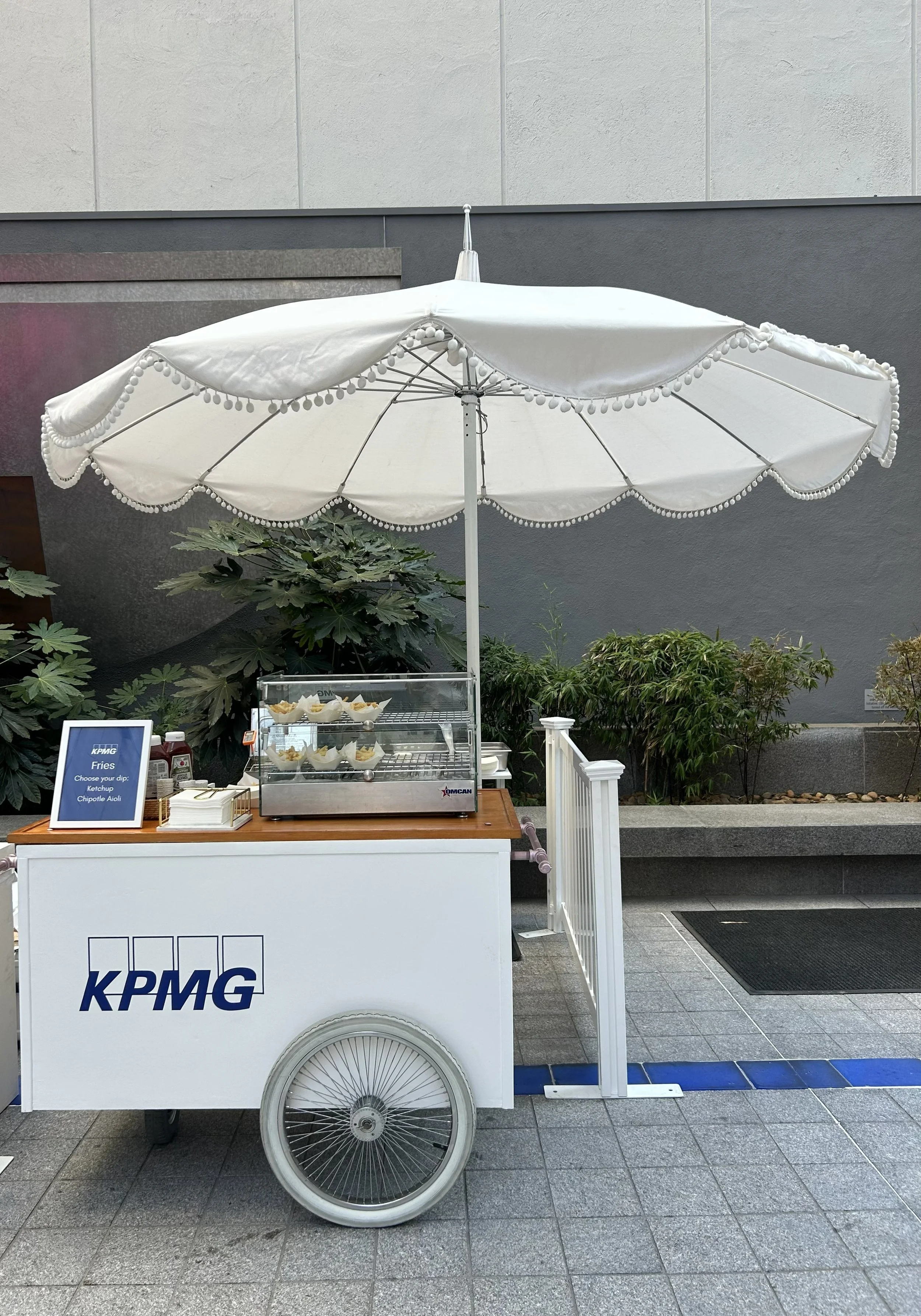 The Jolly Sheep french fry cart catering set up at a corporate employee appreciation event