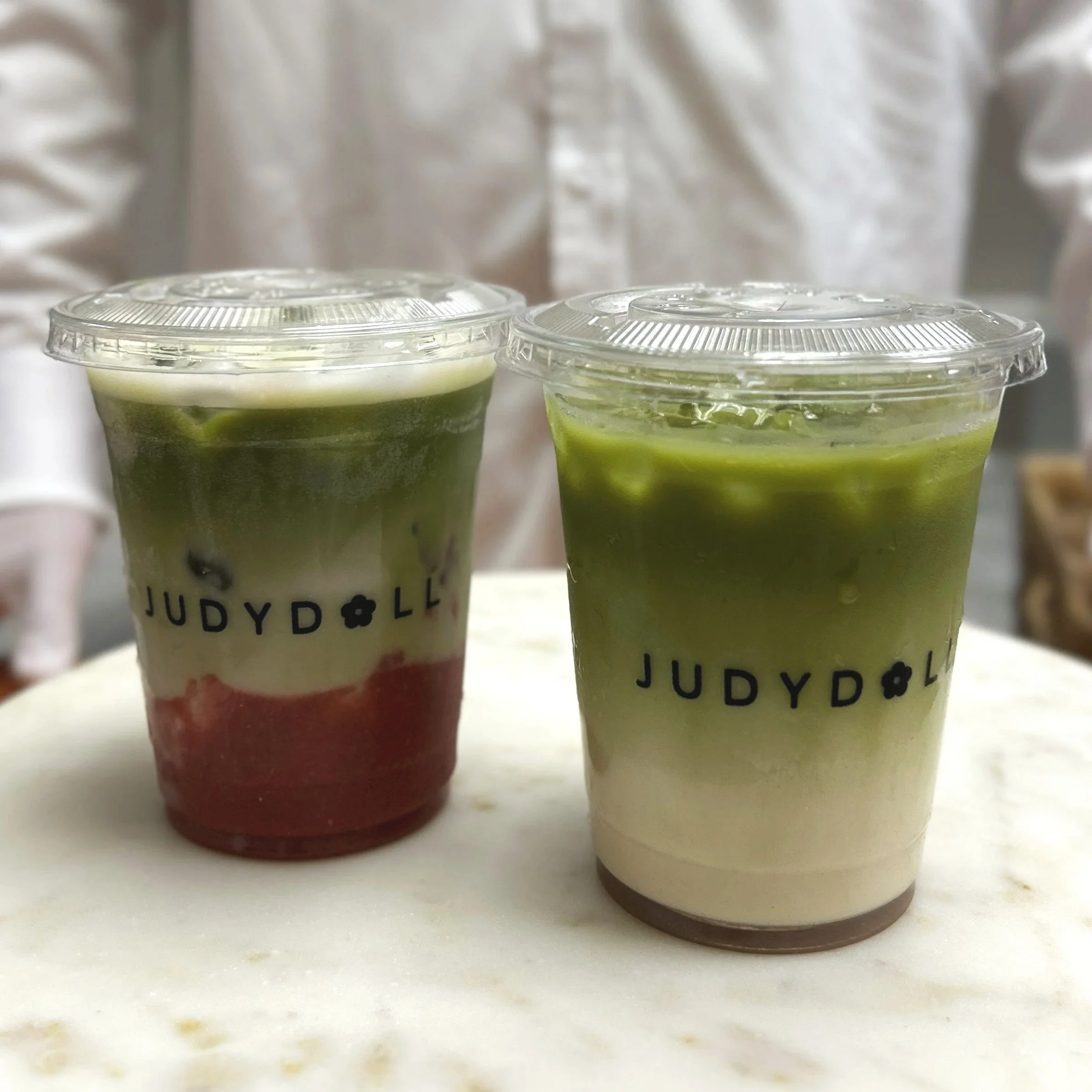 two boba cups with custom prints on the cups