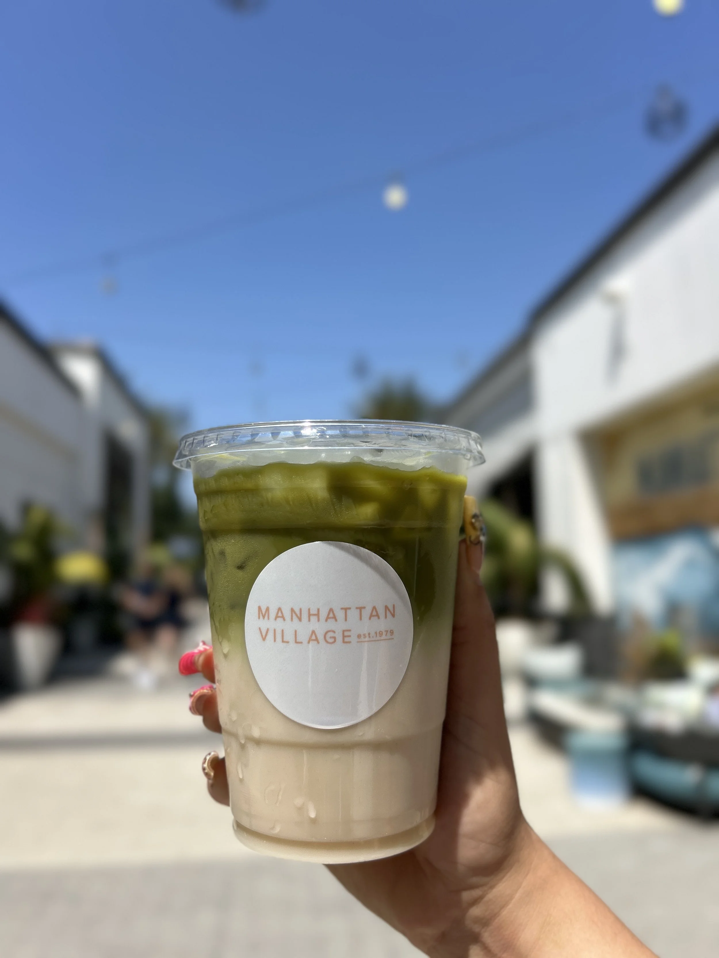 a matcha cup with a manhattan village custom label for a mothers day pop-up
