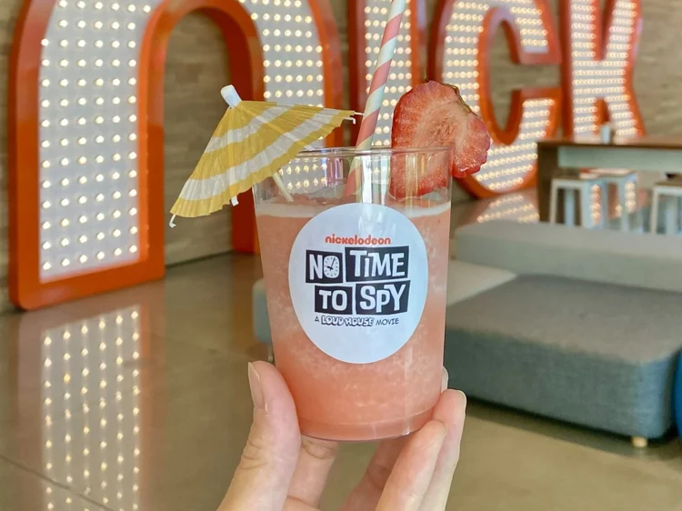 The Jolly Sheep strawberry slushy service: a fresh slushy cup with umbrella and fresh-cut strawberry garnishes for a Nickelodeon employee party.
