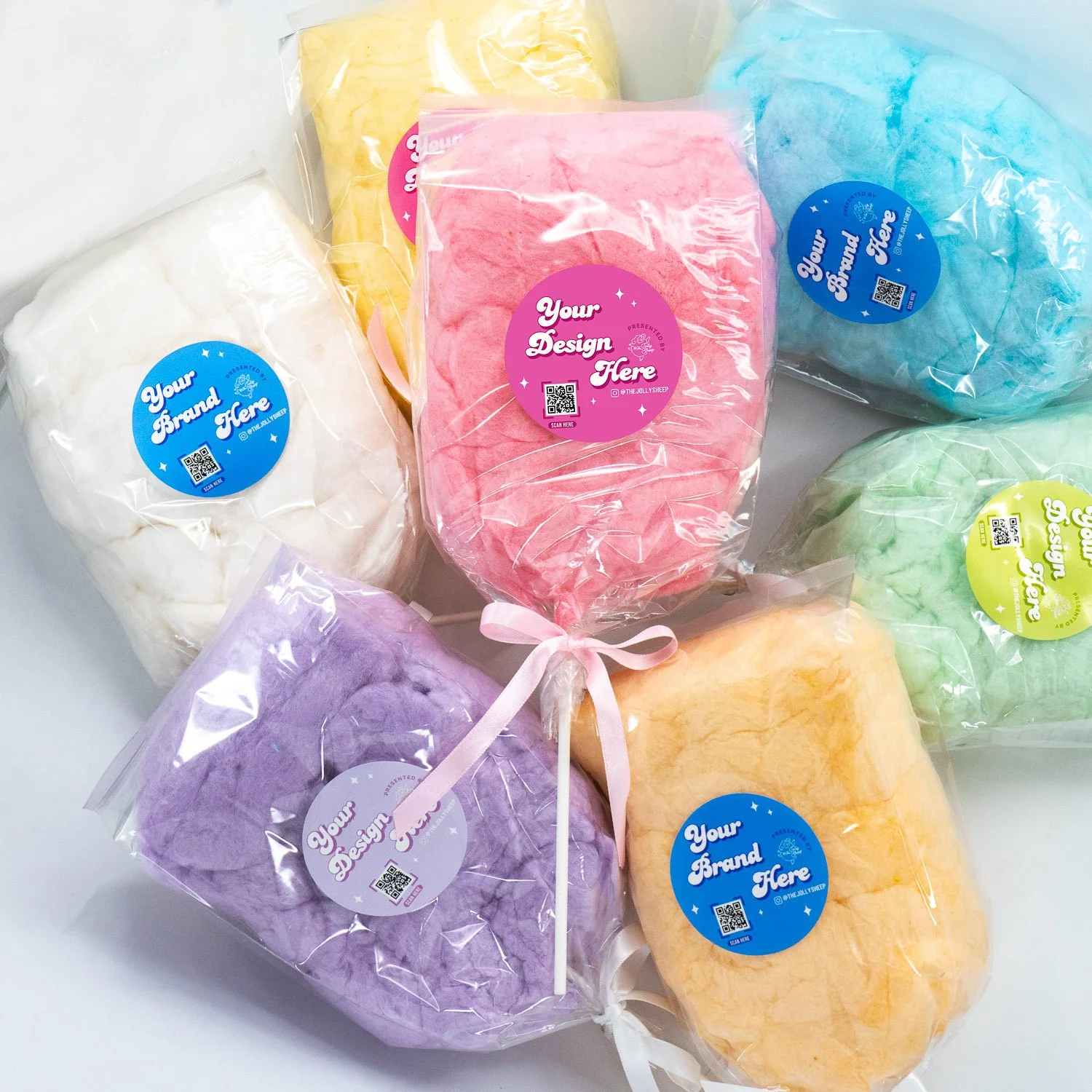 an assortment of cotton candies on a stick in different colors with custom labels