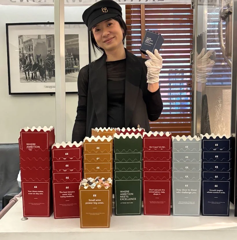 stacks of many different colored custom popcorn boxes