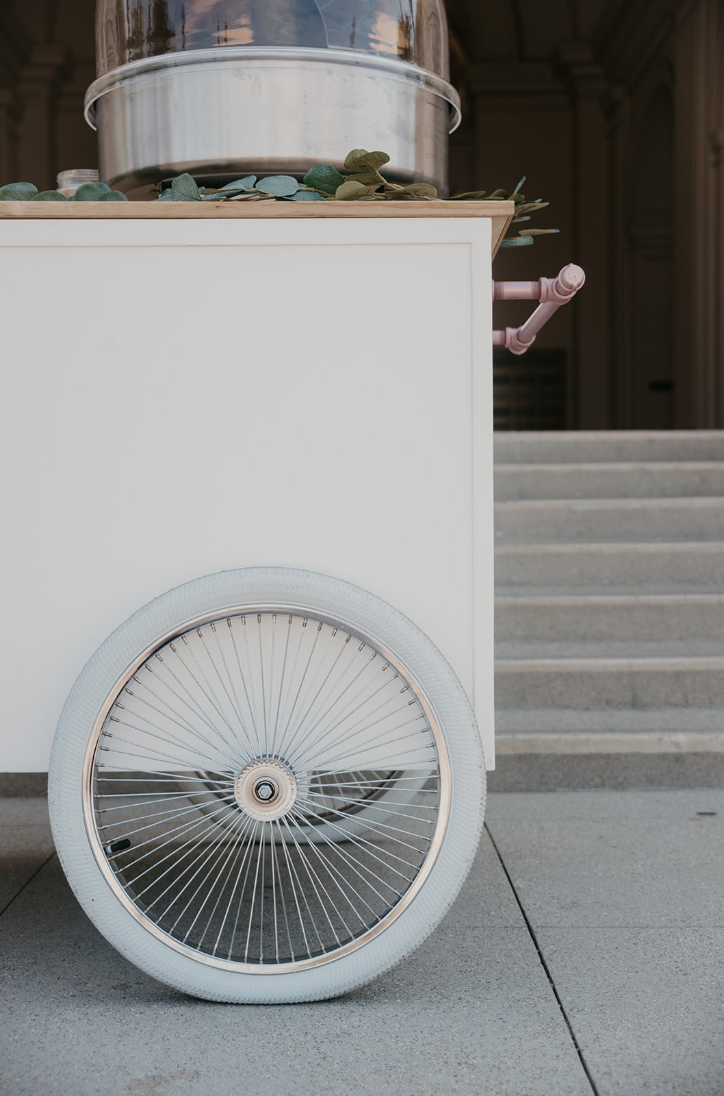 a close up of the jolly sheep's lemonade cart wheel