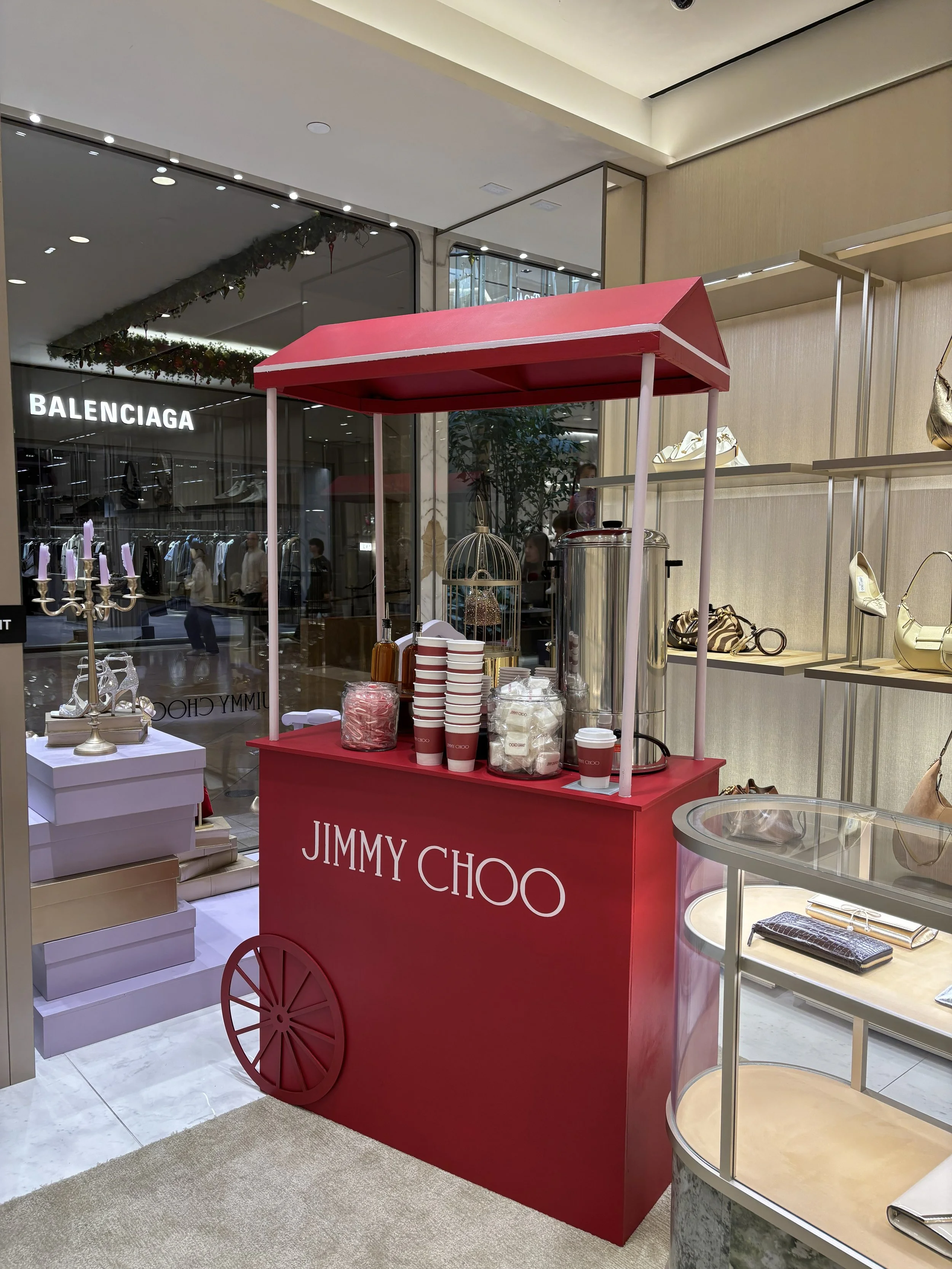 Jimmy Choo custom hot chocolate holiday station with branded cups at South Coast Plaza