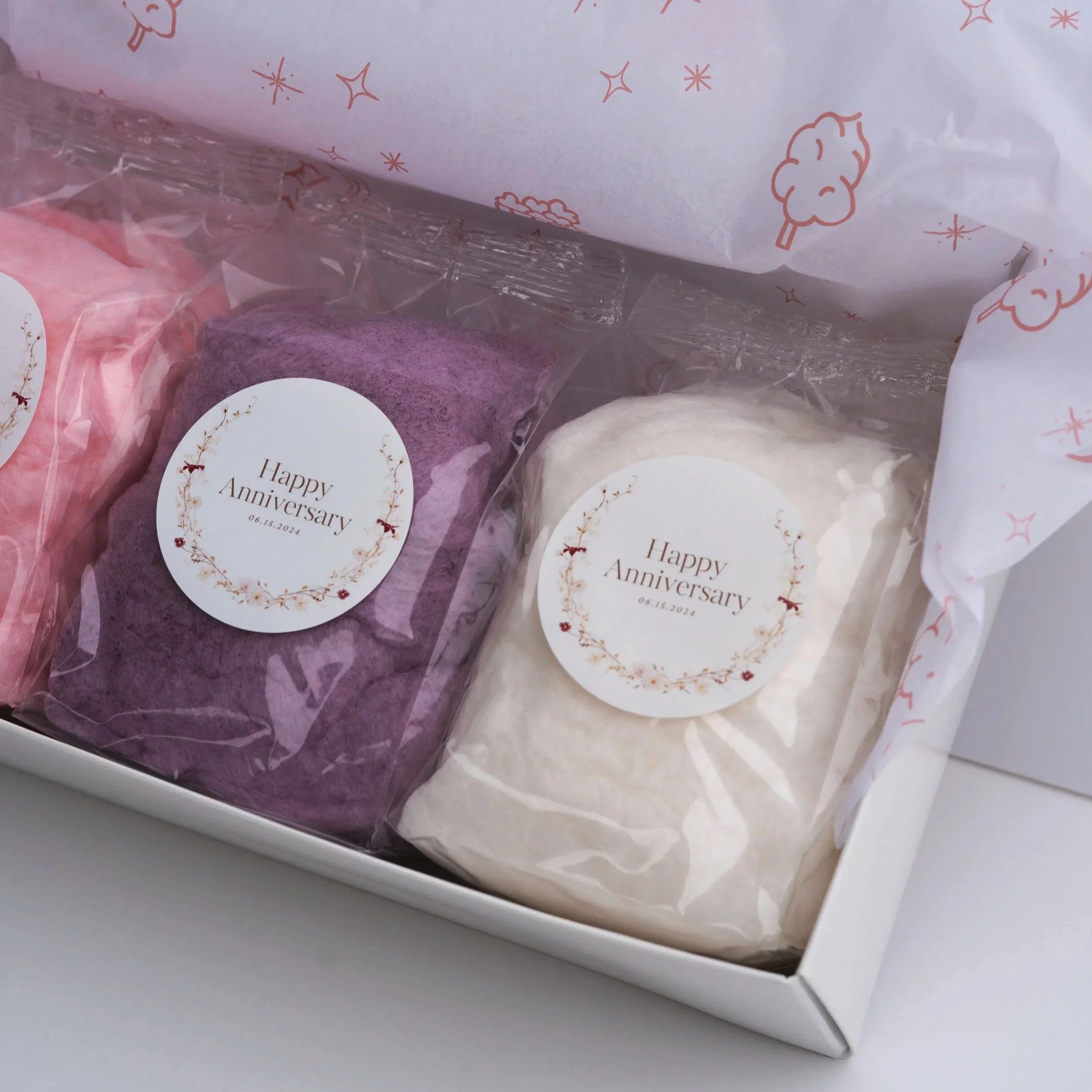 a gift box of cotton candy favors for a wedding anniversary