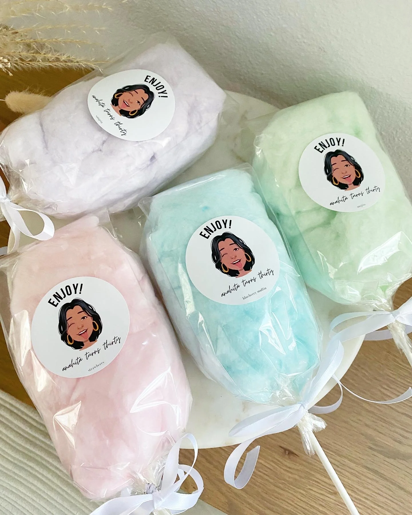 cotton candy on a stick with a 30th birthday custom label