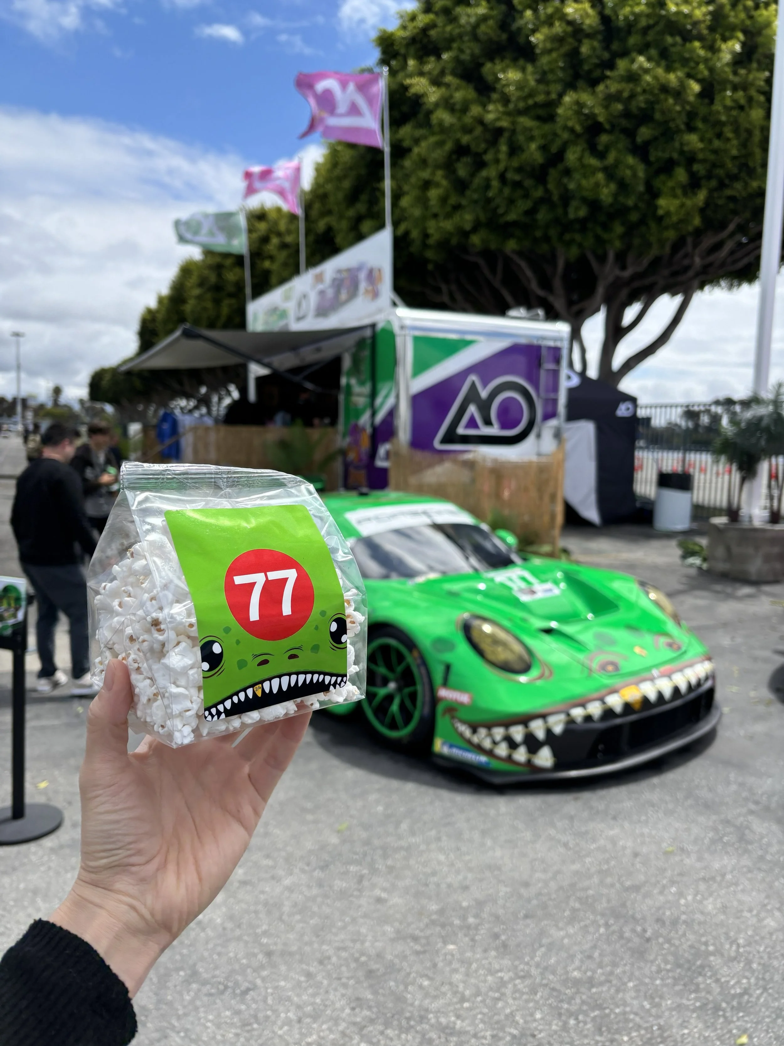 Porsche custom-printed popcorn bags matched to green race car liveries at Air|Water, Costa Mesa
