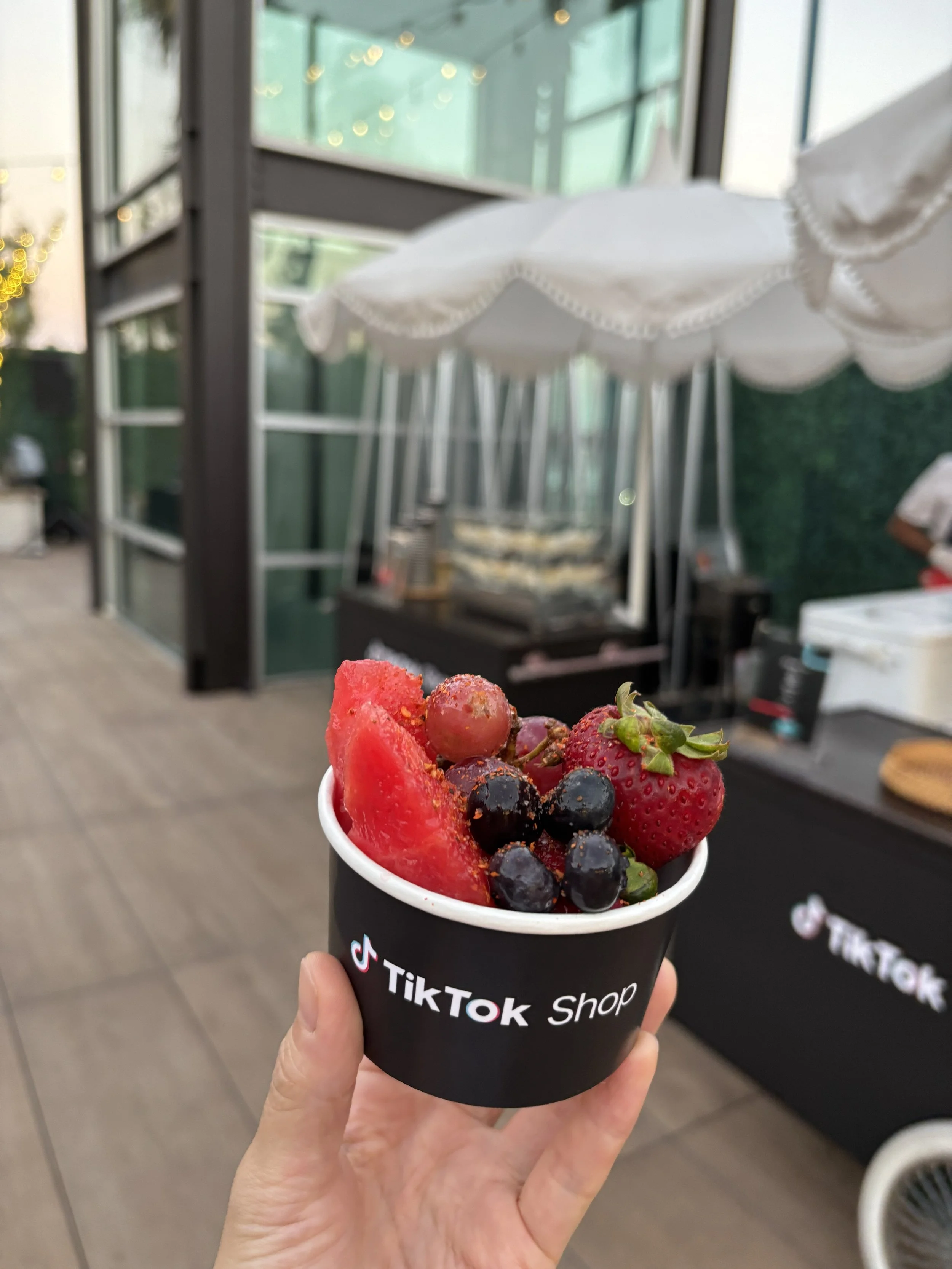 Fresh fruit cup with Tajín from a five-station spread at the TikTok Shop seller forum