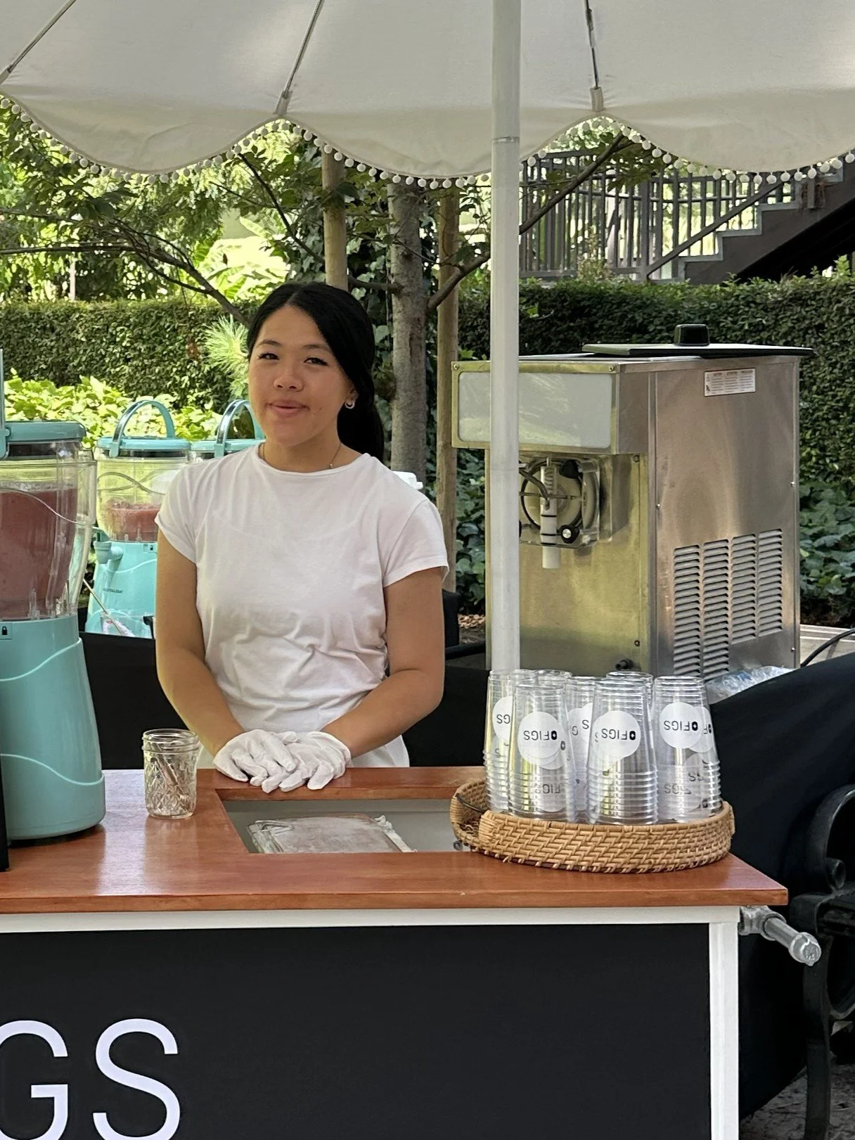 The Jolly Sheep attendant at a slushie cart with commercial unit in the background