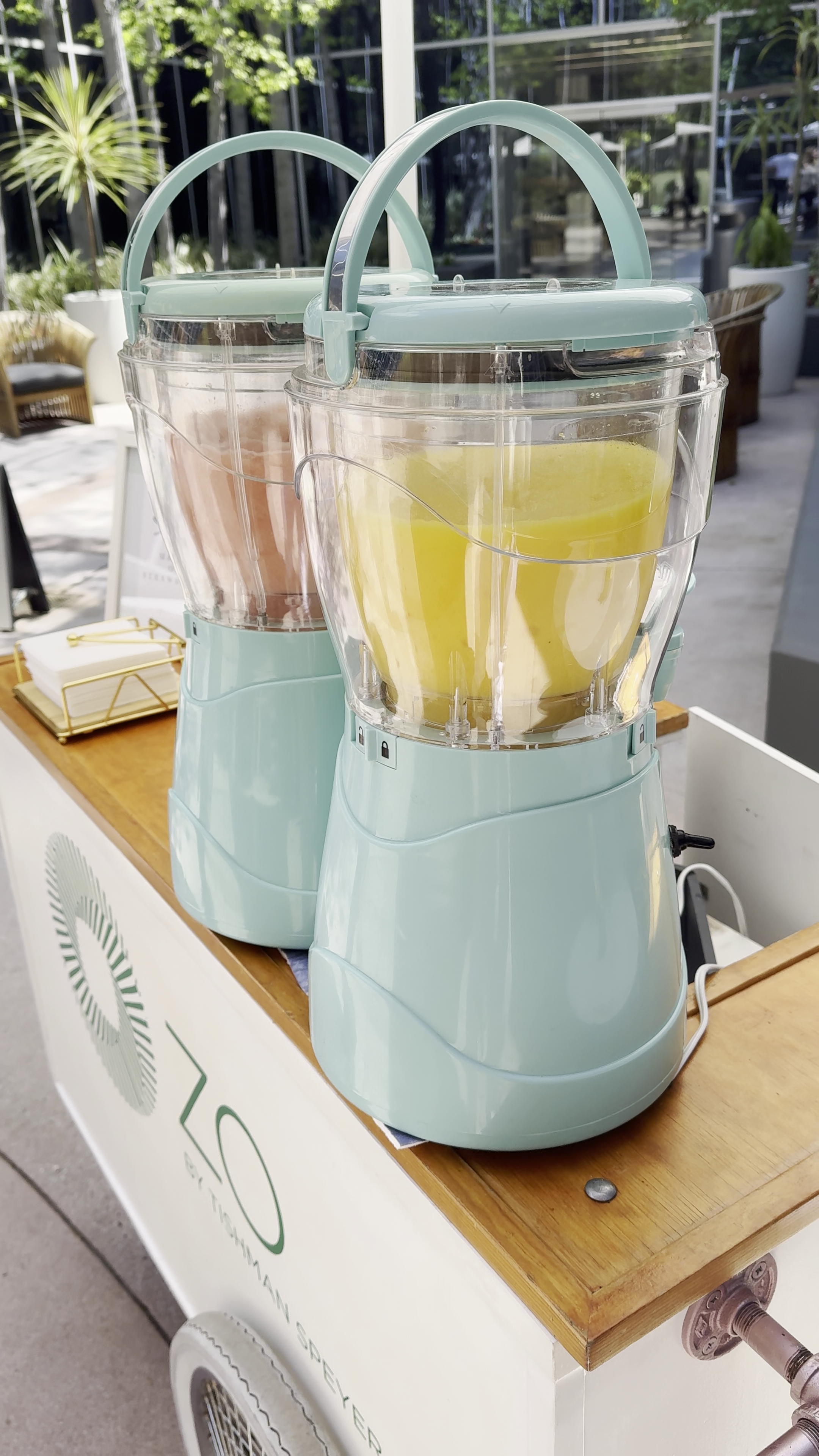 two slushy machines on a cart countertop