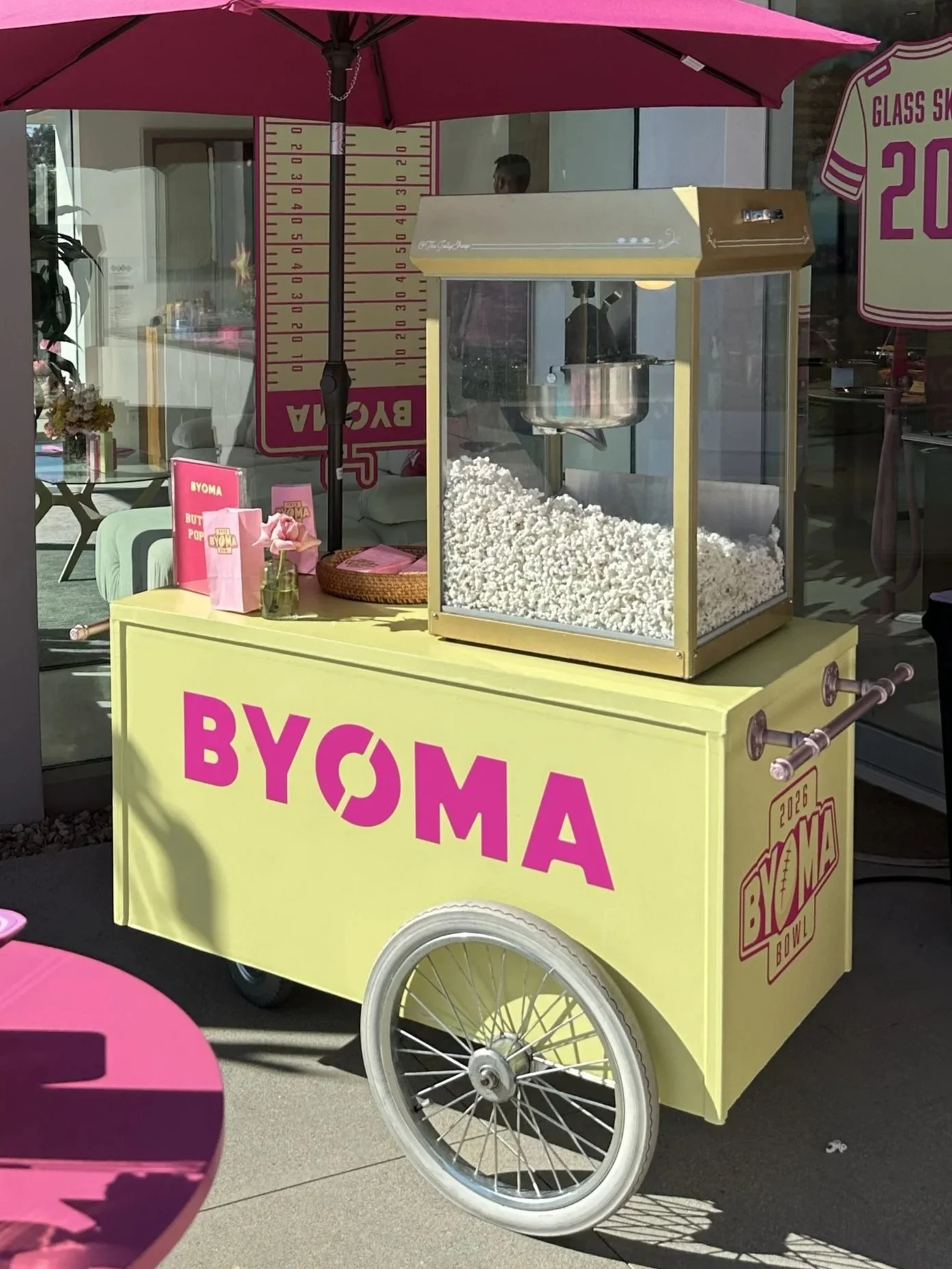 popcorn cart with full-color cart wrap and brand-matched accents for a corporate brand activation