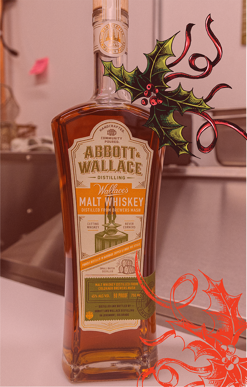 A bottle of Abbott & Wallace Wallace’s Malt Whiskey with holiday graphics