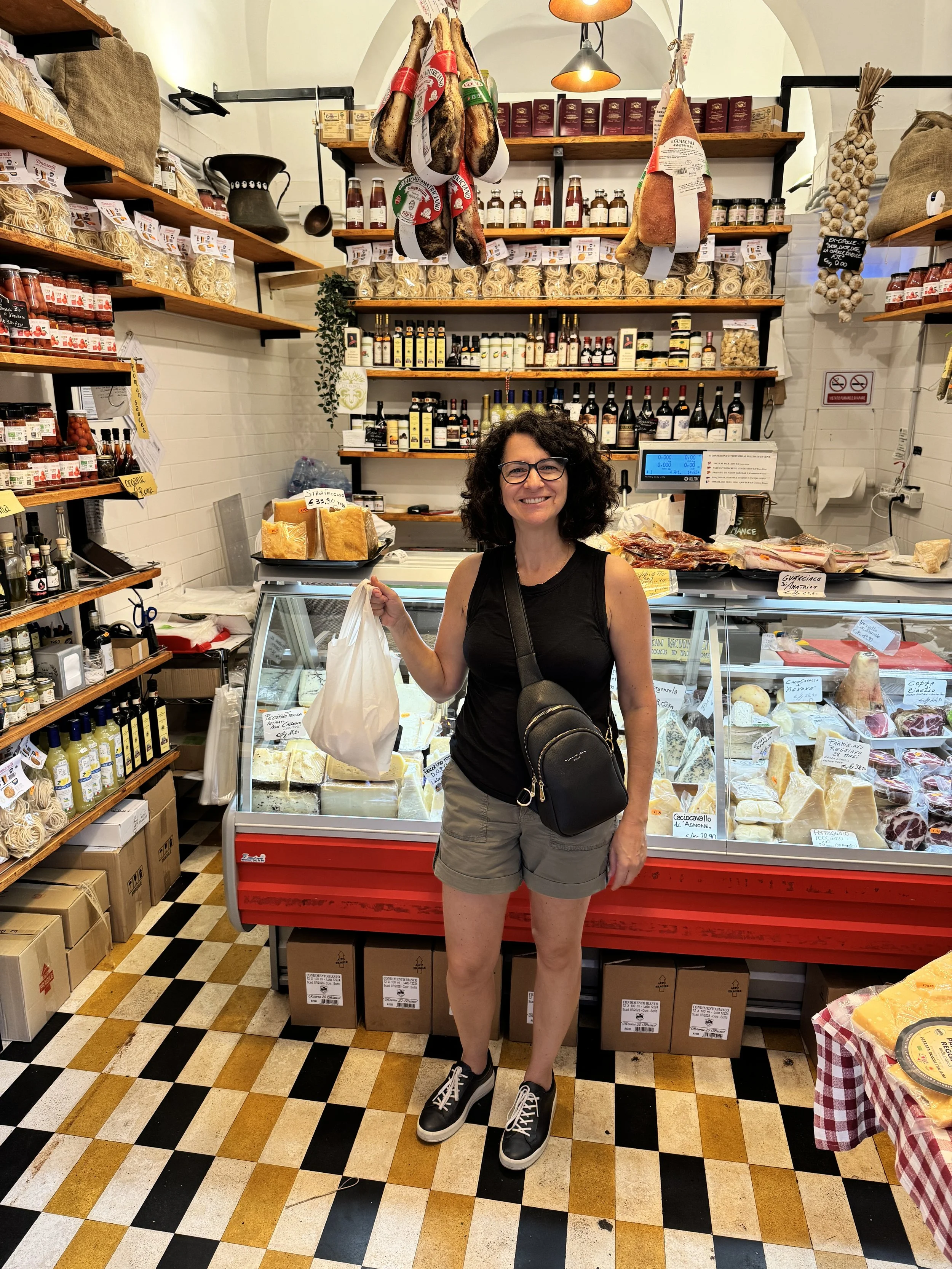 Chef Debbie buying cheese in Rome after a culinary tour.JPG