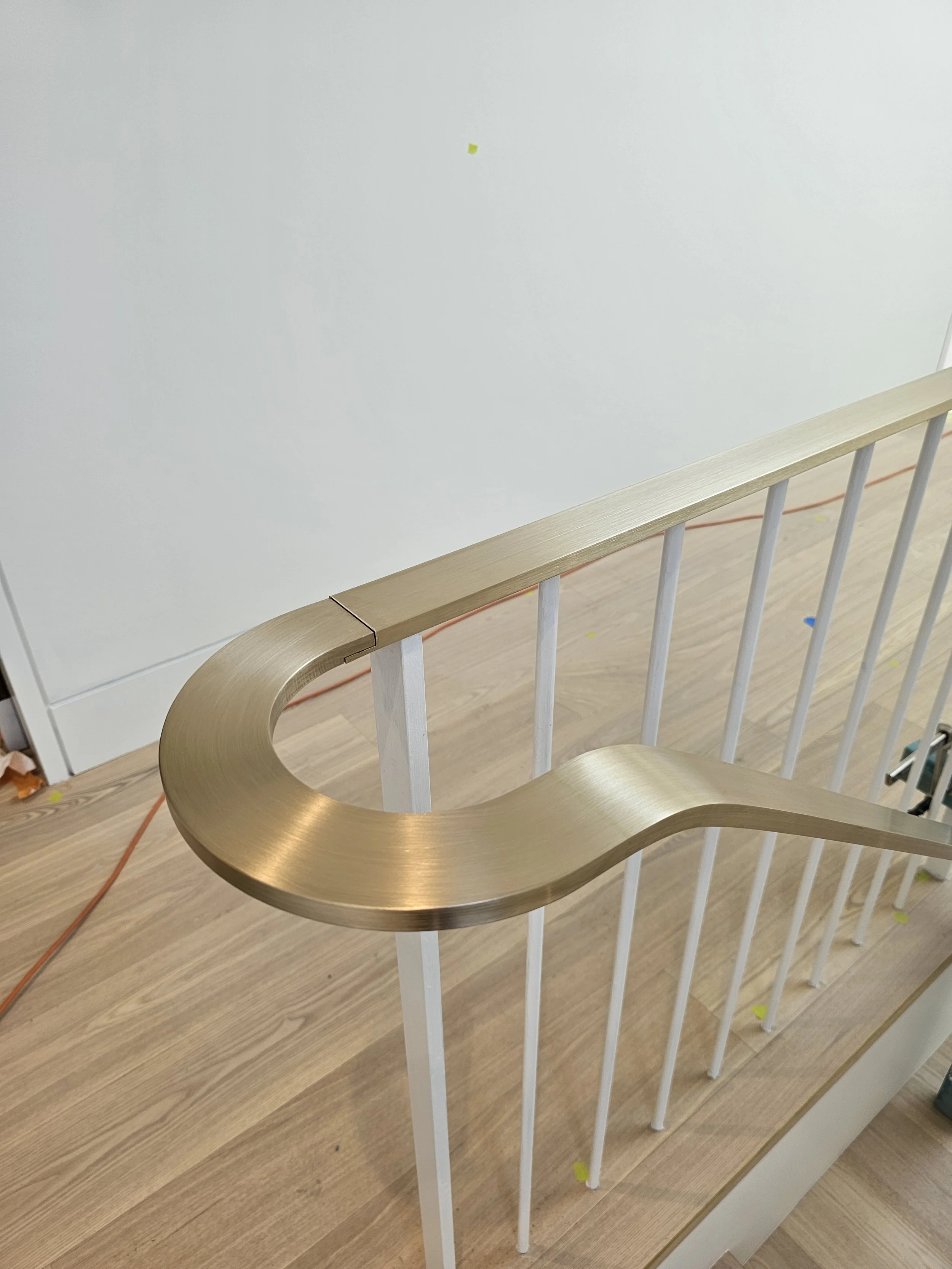 Curved brass handrail